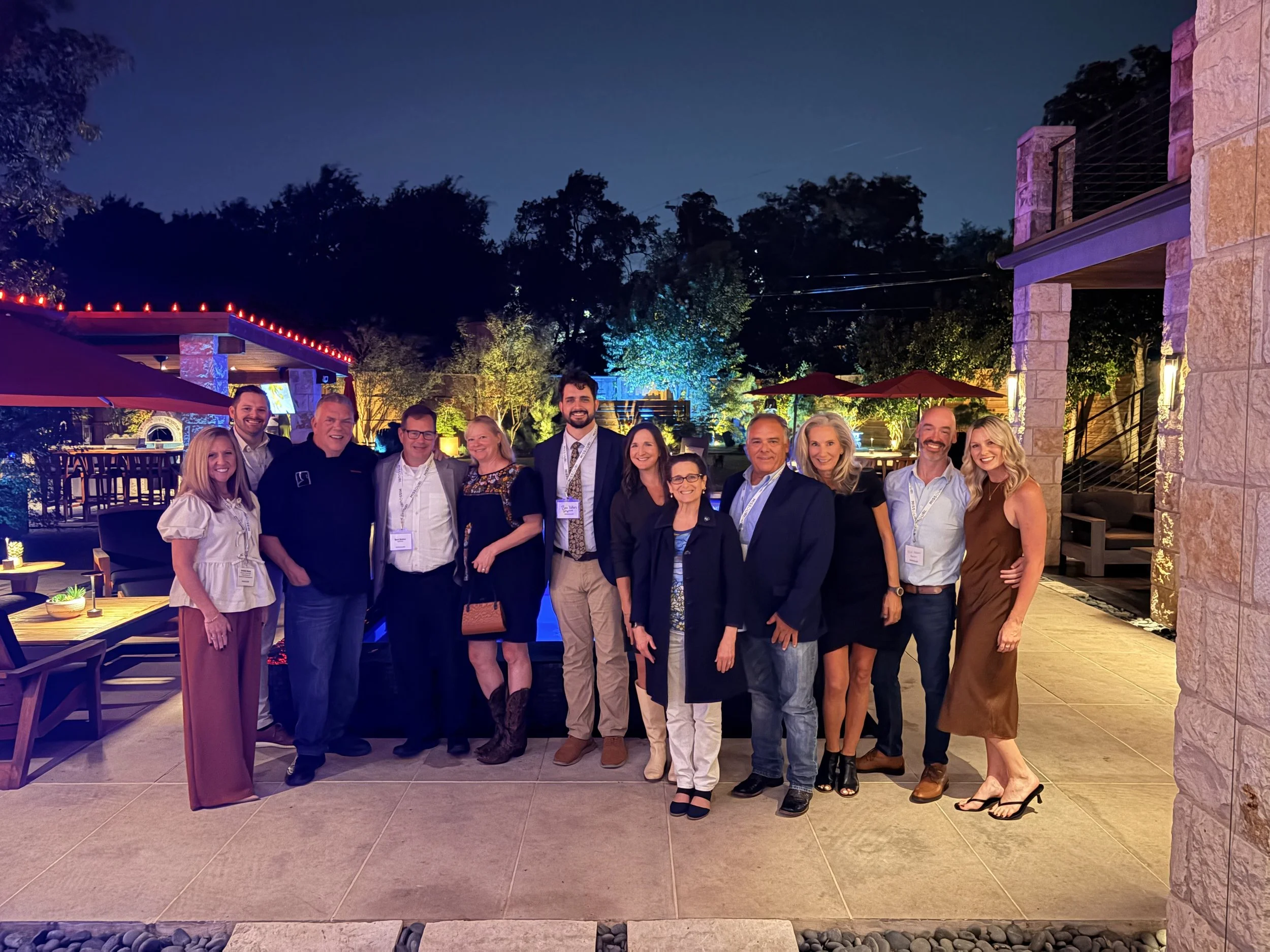 Group photo on a patio at night