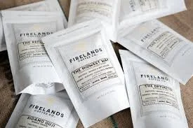 Various firelands service tickets or receipts spread out on a wooden surface.