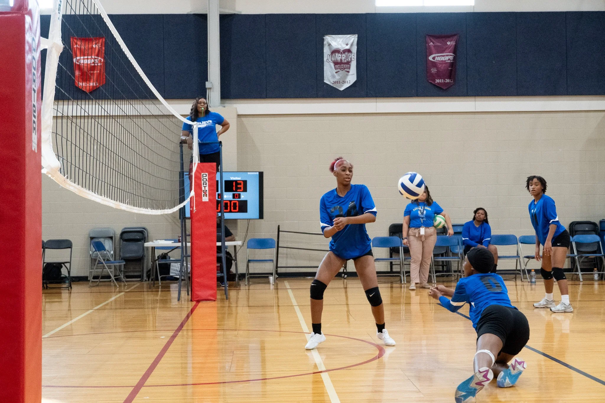 Volleyball diving for ball