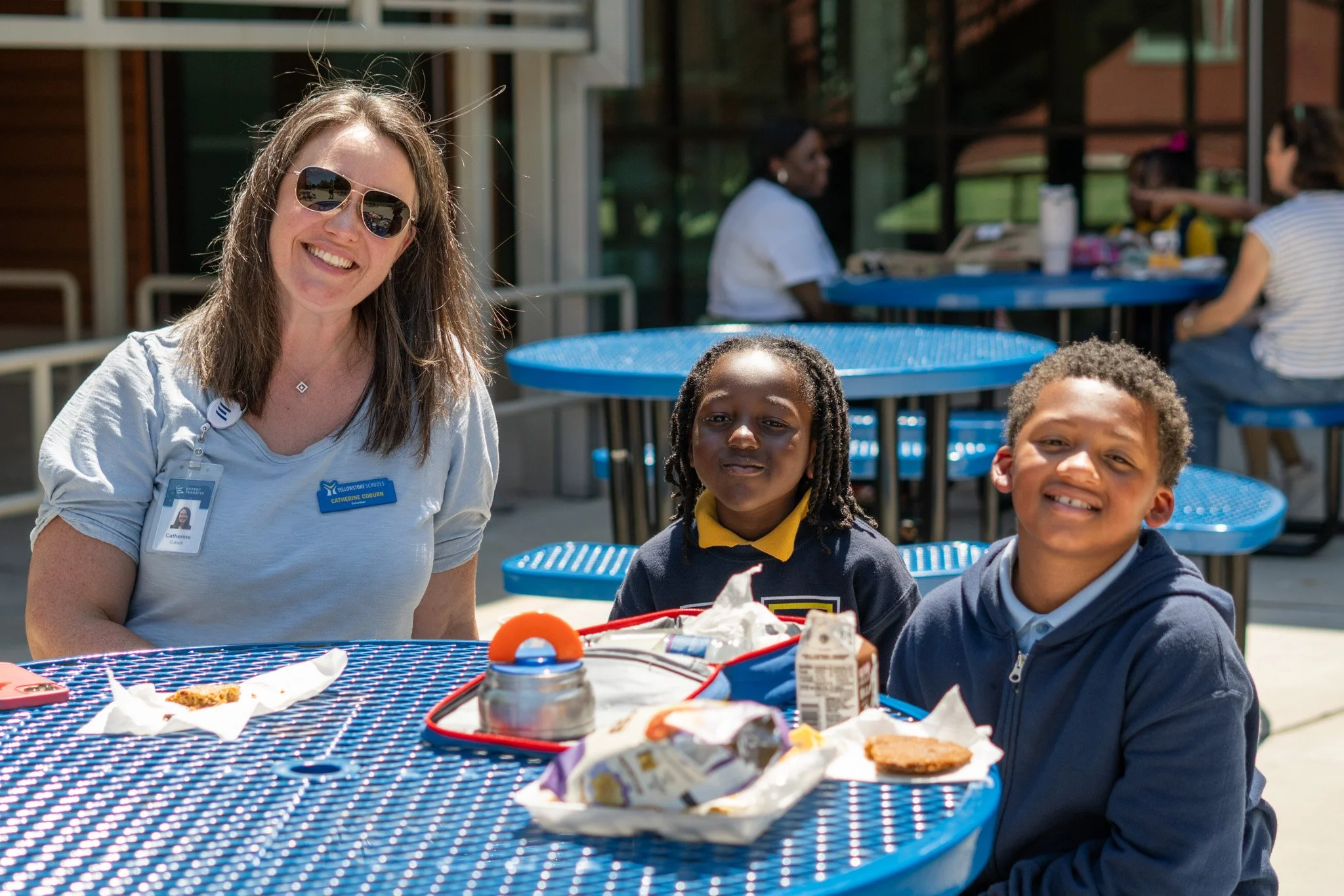 Volunteer with her lunch buddies