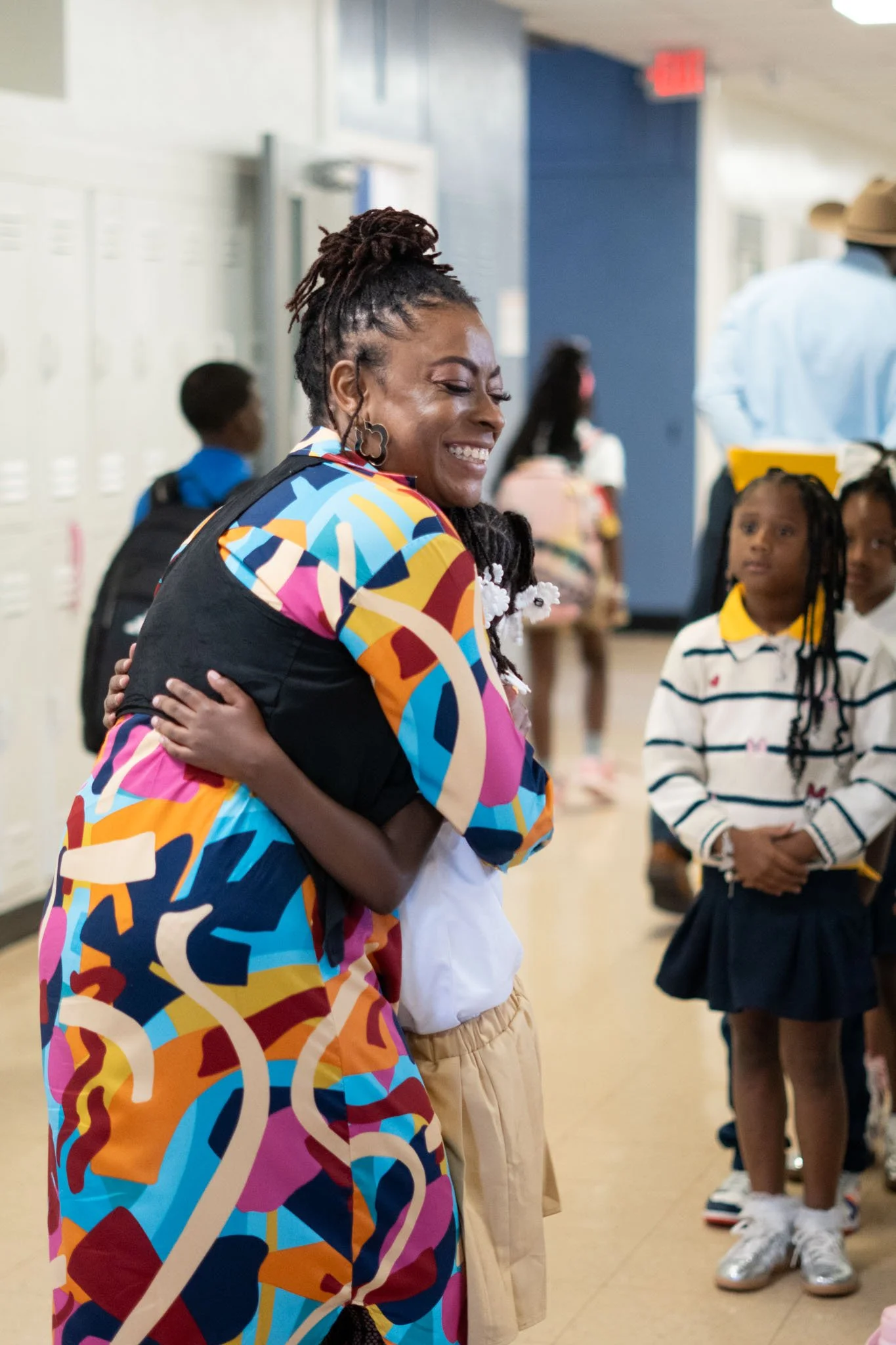 Teacher hugging student