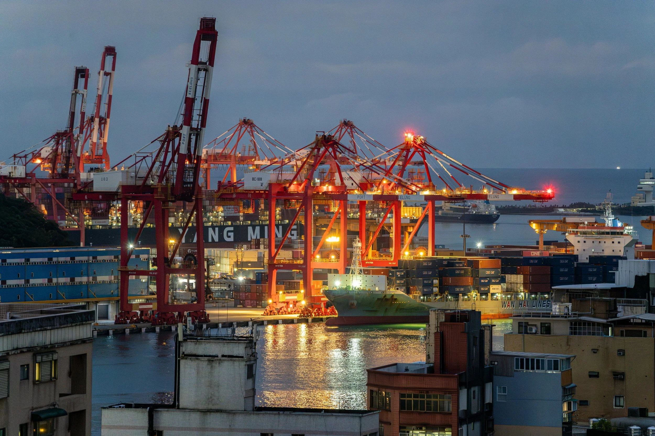 Cargo cranes loading shipping containers at a commercial port
