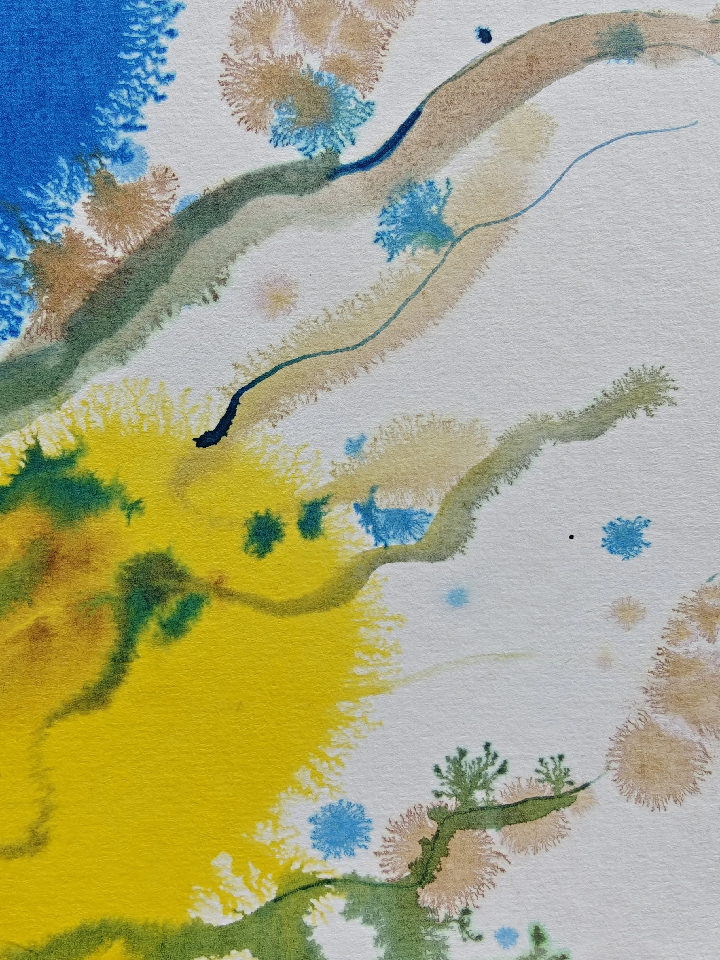 Abstract watercolor painting with splashes of yellow, green, blue, and brown colors, resembling a landscape with trees and flowing lines.