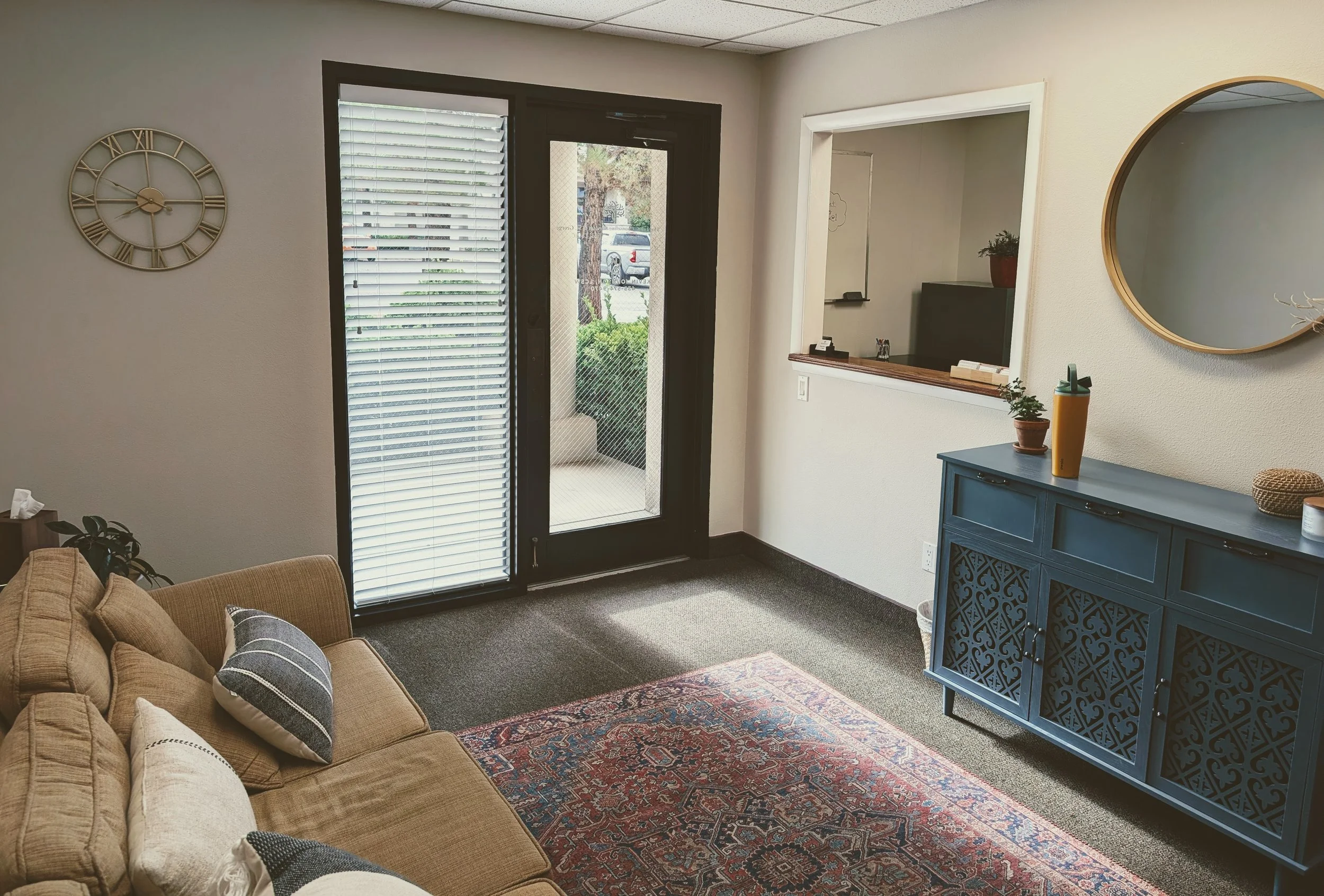 Private psychotherapy office interior for individual and telehealth counseling sessions.