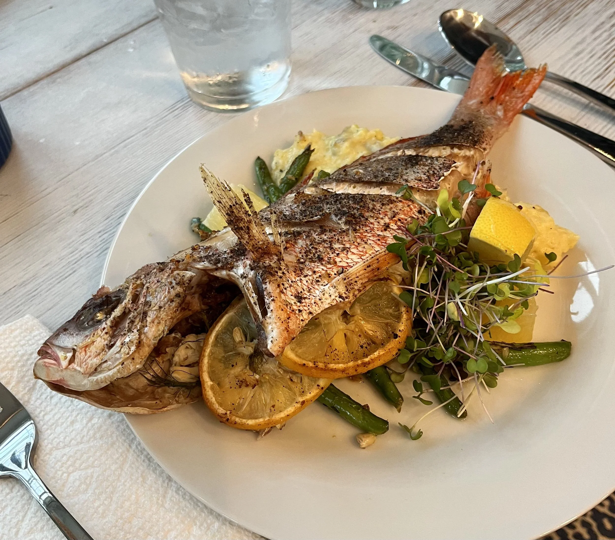 Whole Roasted Sea Bass Stuffed with Crab, Lemon, and Dill, with Yukon Gold Mash and Sautéed Green Beans