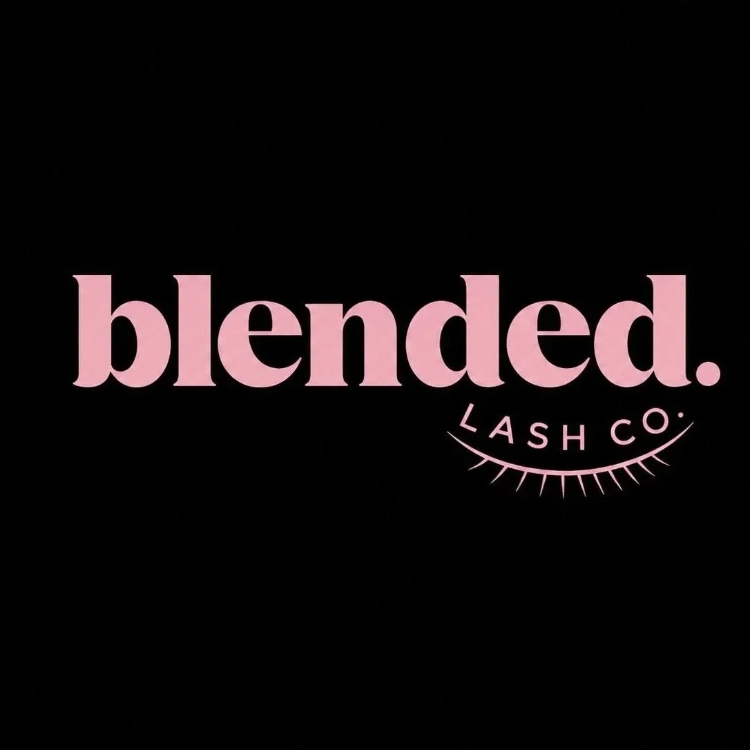 Text logo that reads 'blended.' in large pink letters with a curved eye illustration underneath containing the words 'LASH CO' on a black background.
