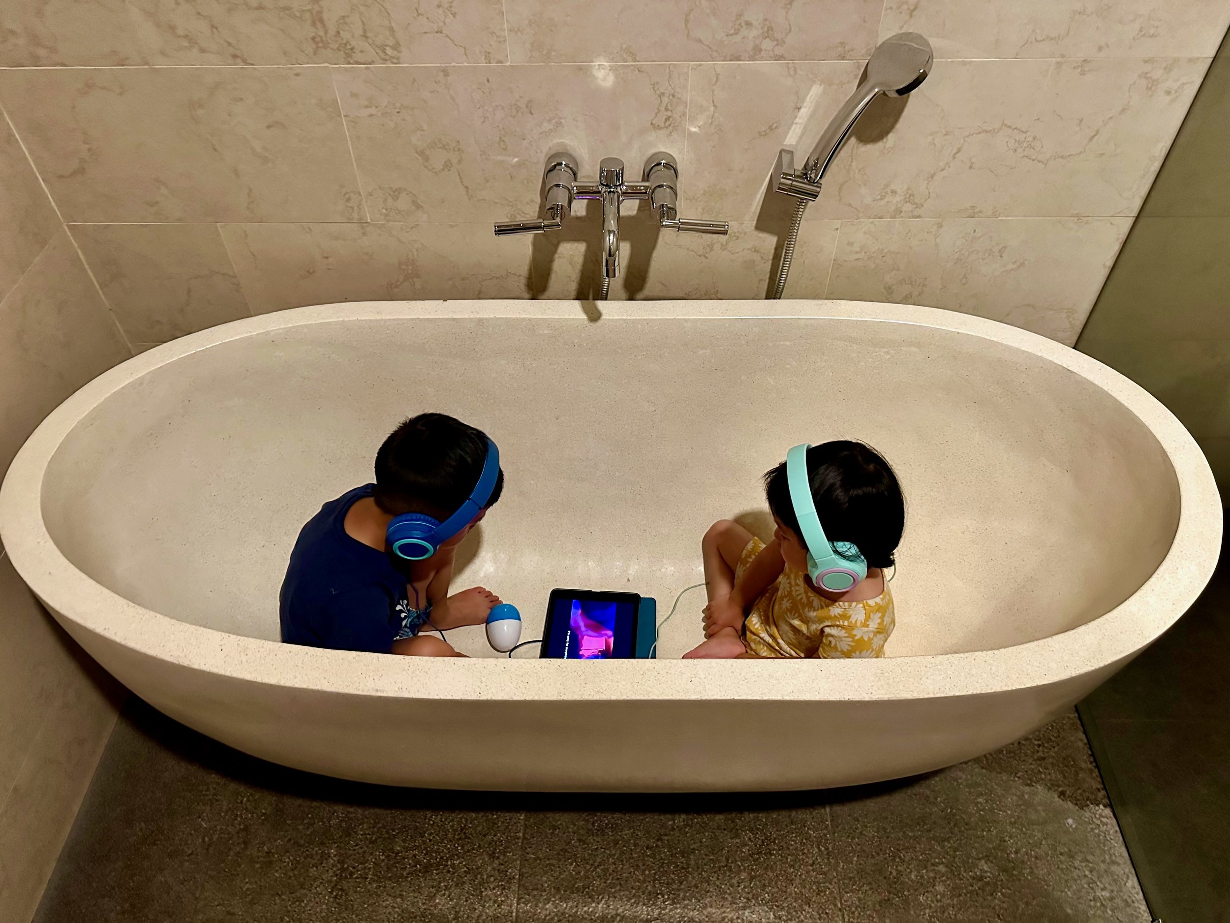 Kids watching a movie while mom and dad get a massage