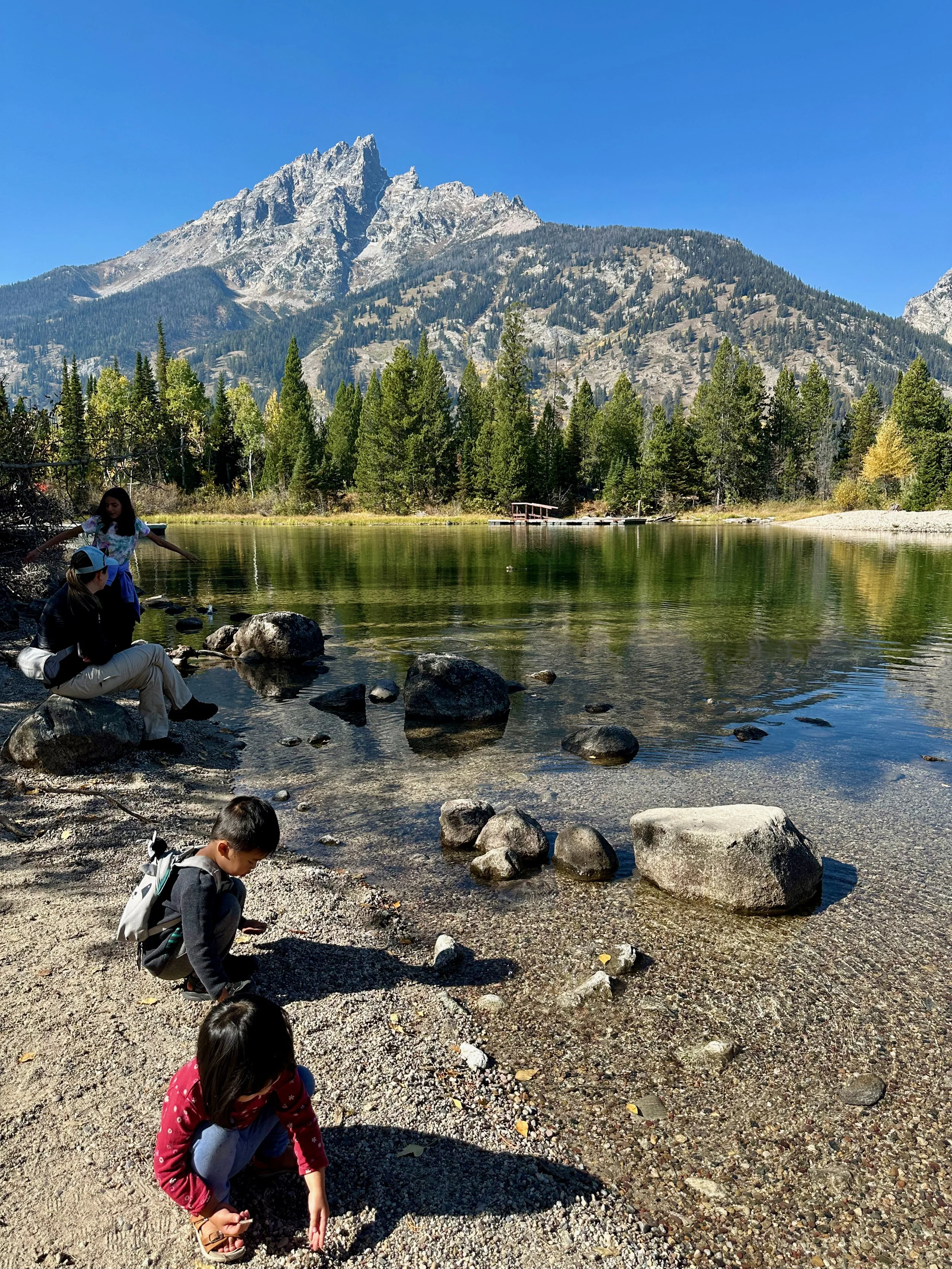 Throwing rocks into Jenny Lake