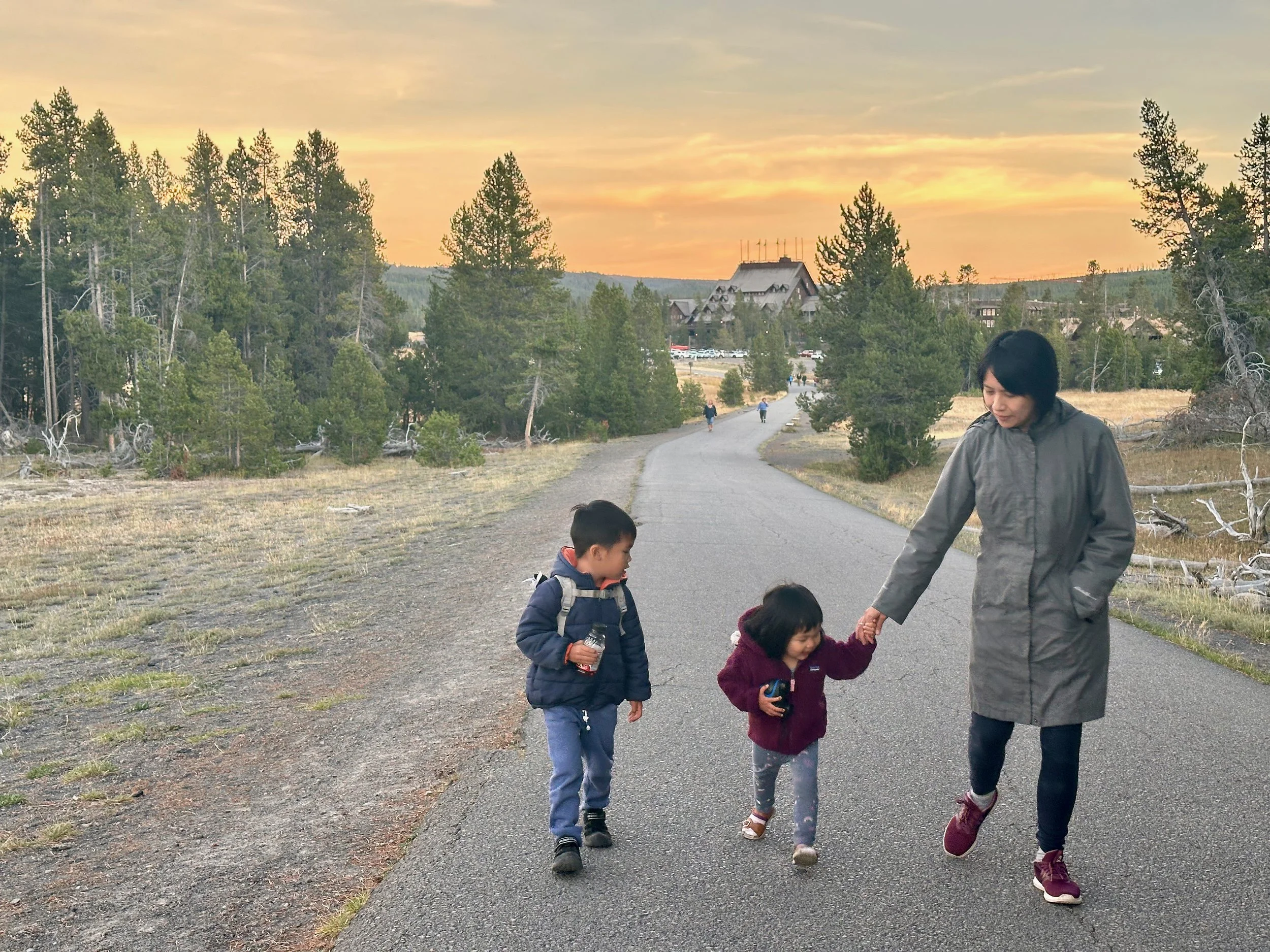 Walk to the Upper Geyser Basin with Old Faithful Inn in the background