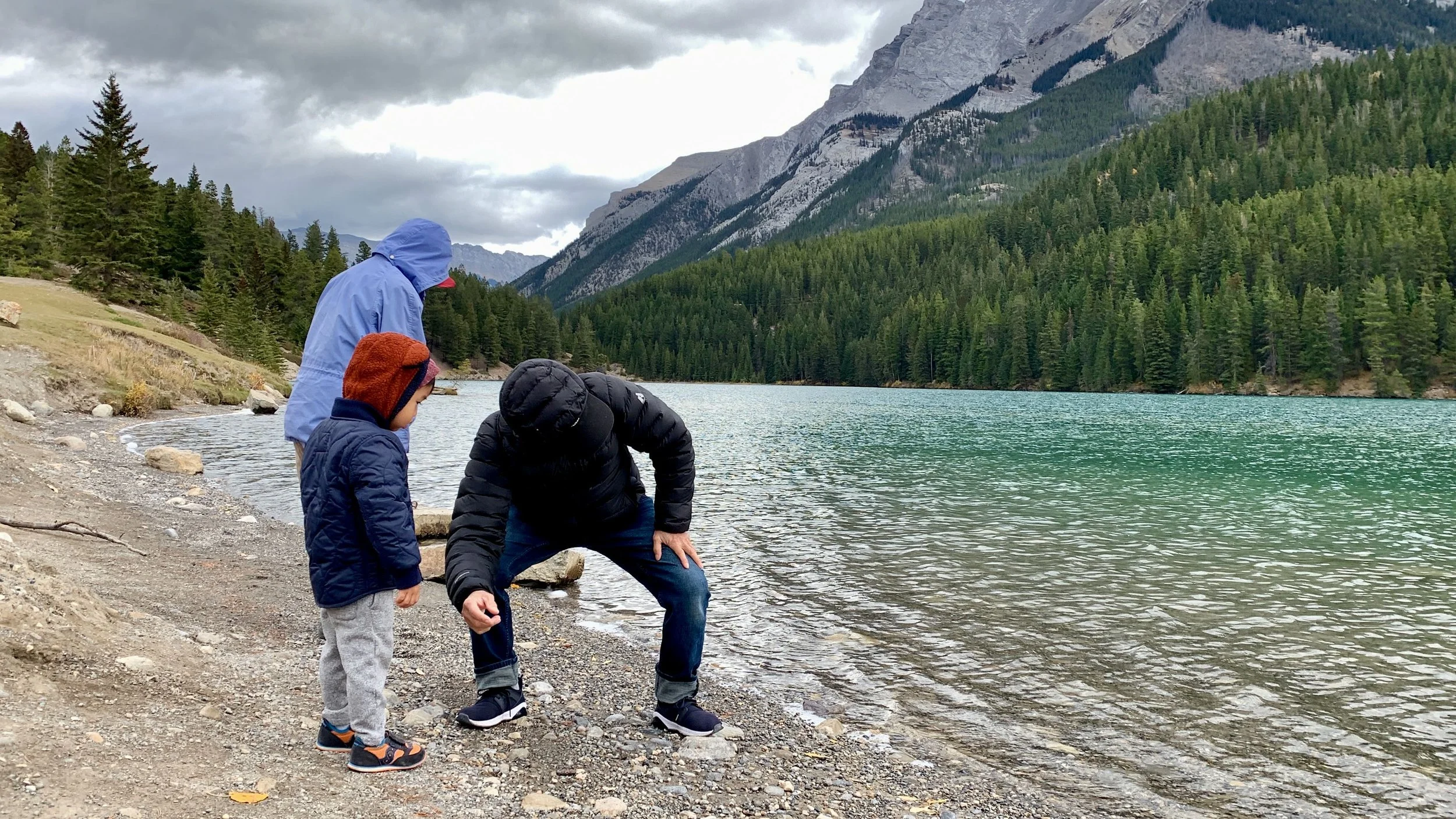 Grandpa skipping rocks at Two Jack Lake