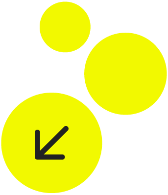 Four yellow circles of different sizes with a black arrow inside the largest circle pointing downward and to the left.