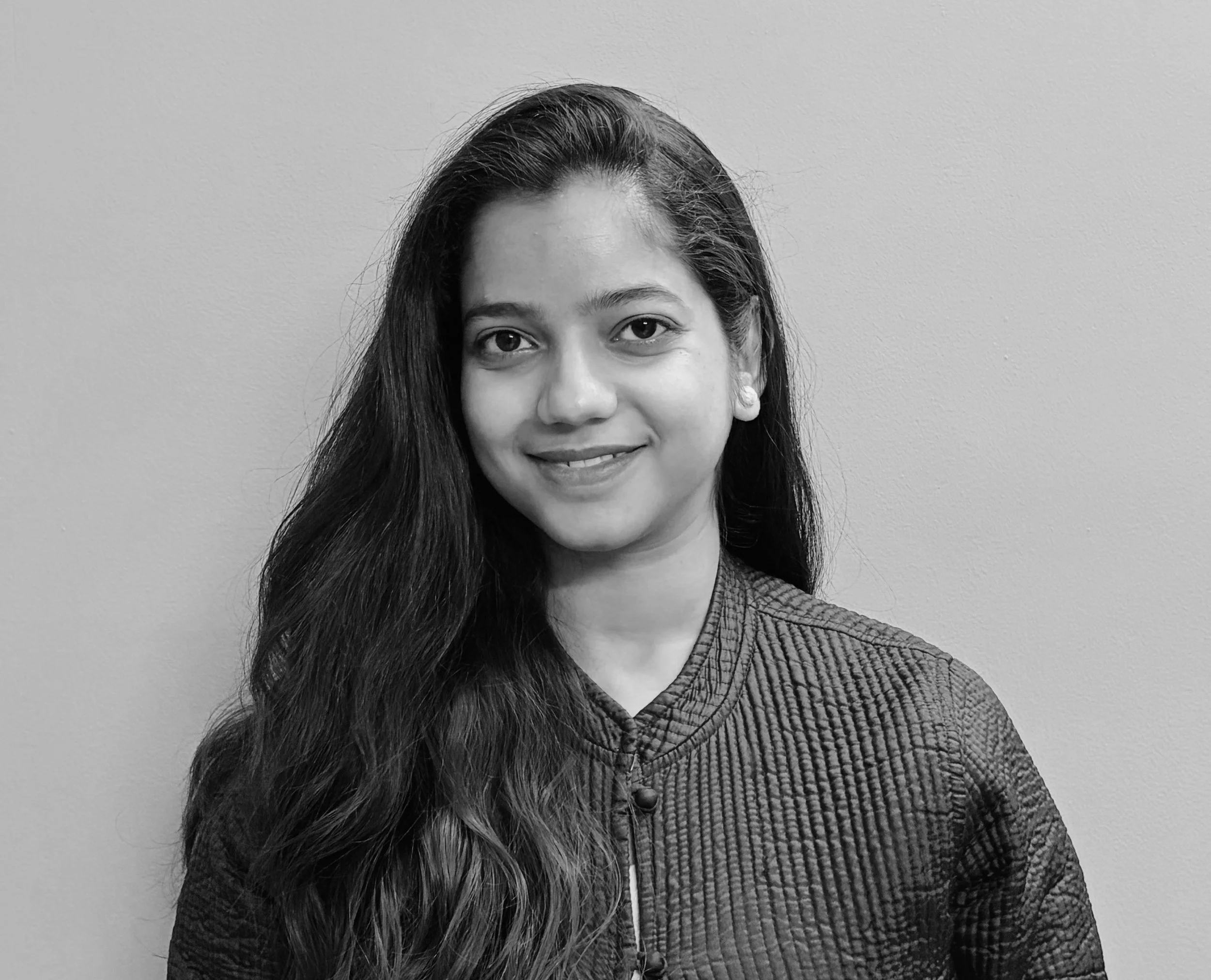 Professional headshot of Nancy Gupta, Assistant Director of Research, Training & Data Insights at The Bias Adjuster