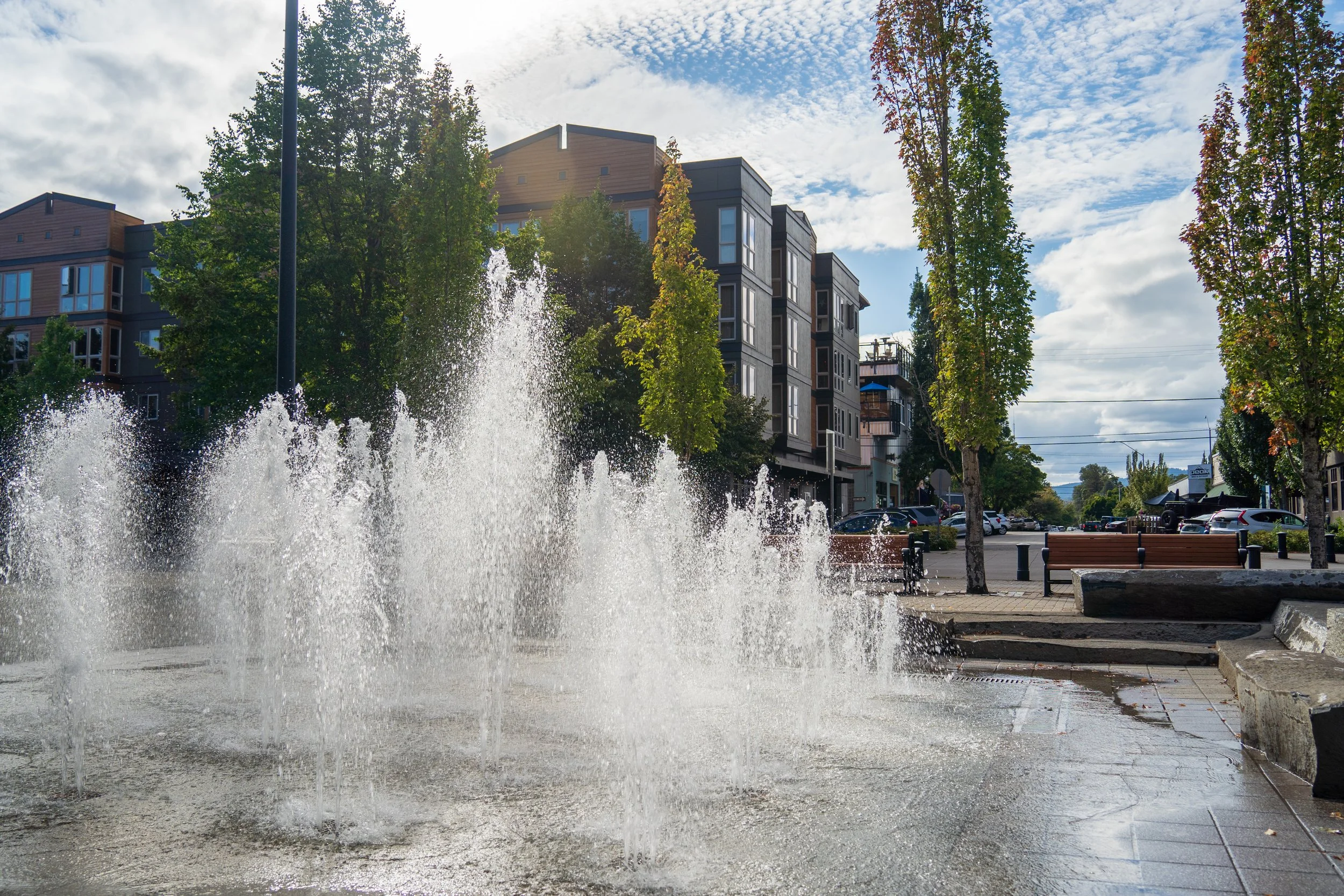 A photo of the downtown fountain in front of the Jax appartment building.