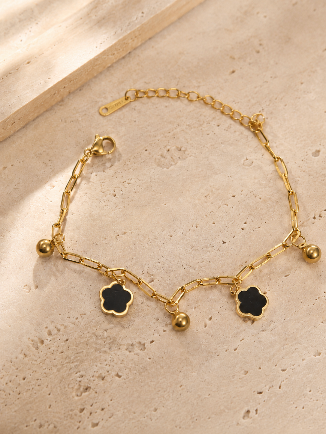 Clover Black Charm Bracelet.png