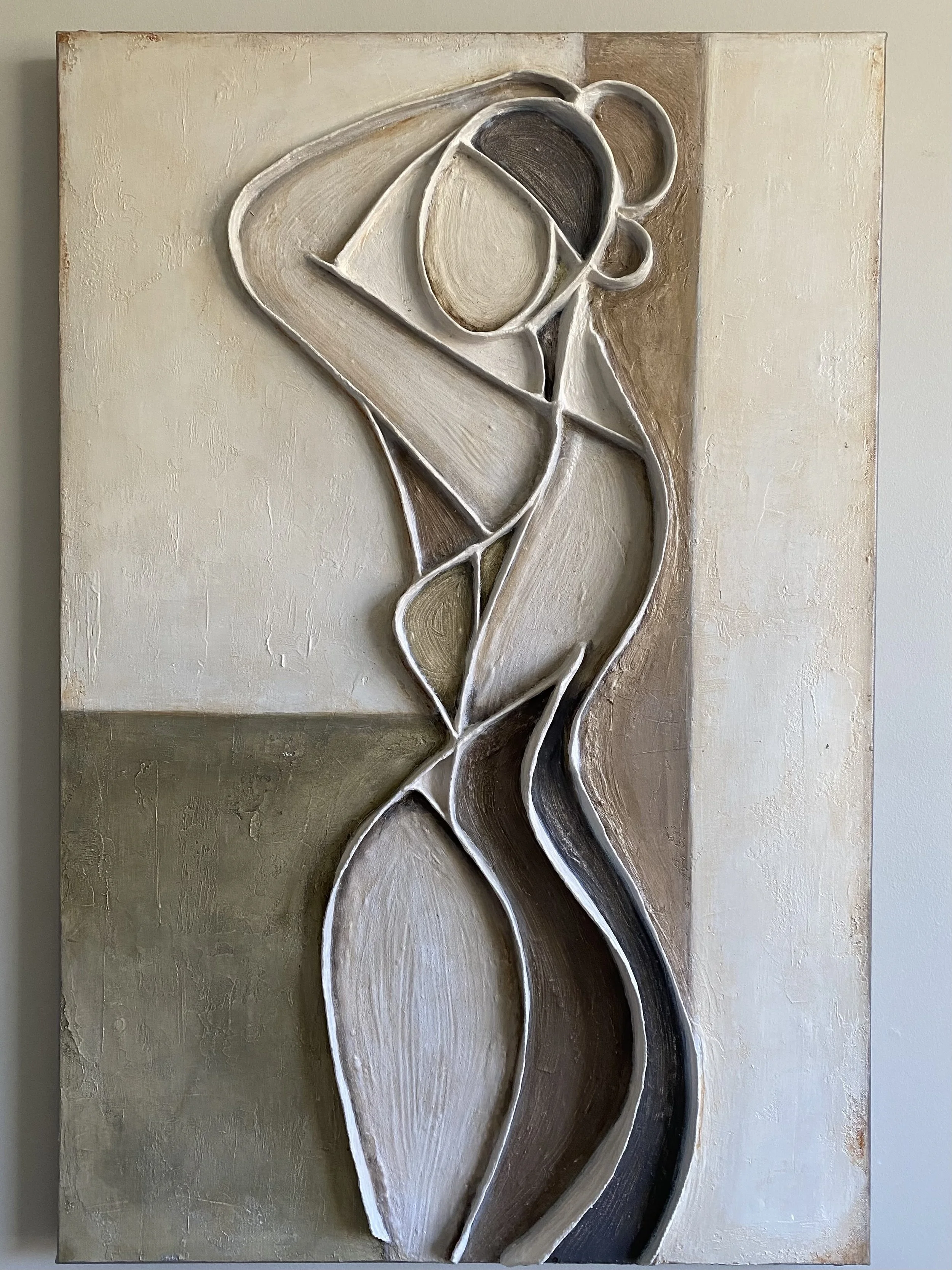 Abstract textured wall art featuring overlapping sculptural leaf shapes in white, brown, gray, and black tones
