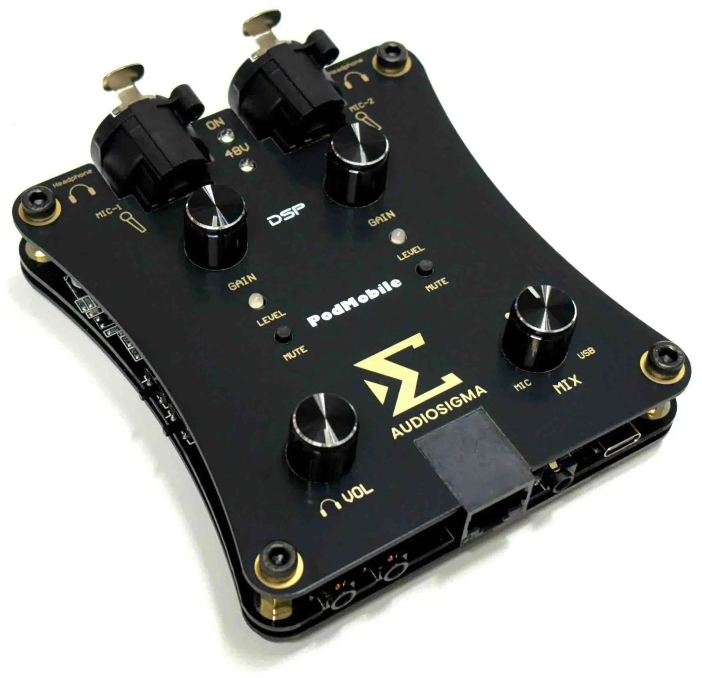 Close-up of audio equipment with knobs, switches, and labels including 'DSP', 'GAIN', and 'MUTE' on a black panel with yellow accents.