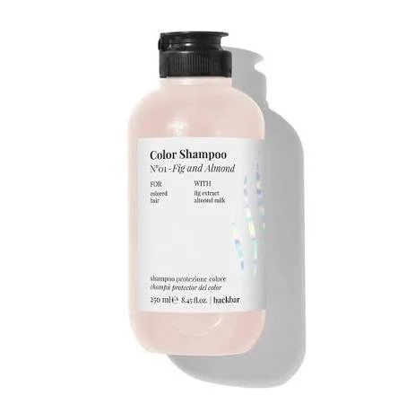 A bottle of color shampoo labeled No. 1 Fig and Almond with 250 ml capacity, designed for colored hair, containing fig extract and almond milk.