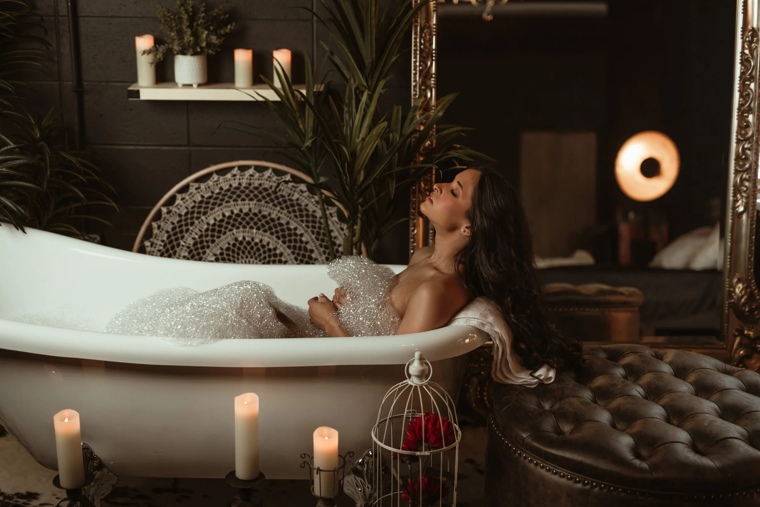Woman in bubble bath posing seductively