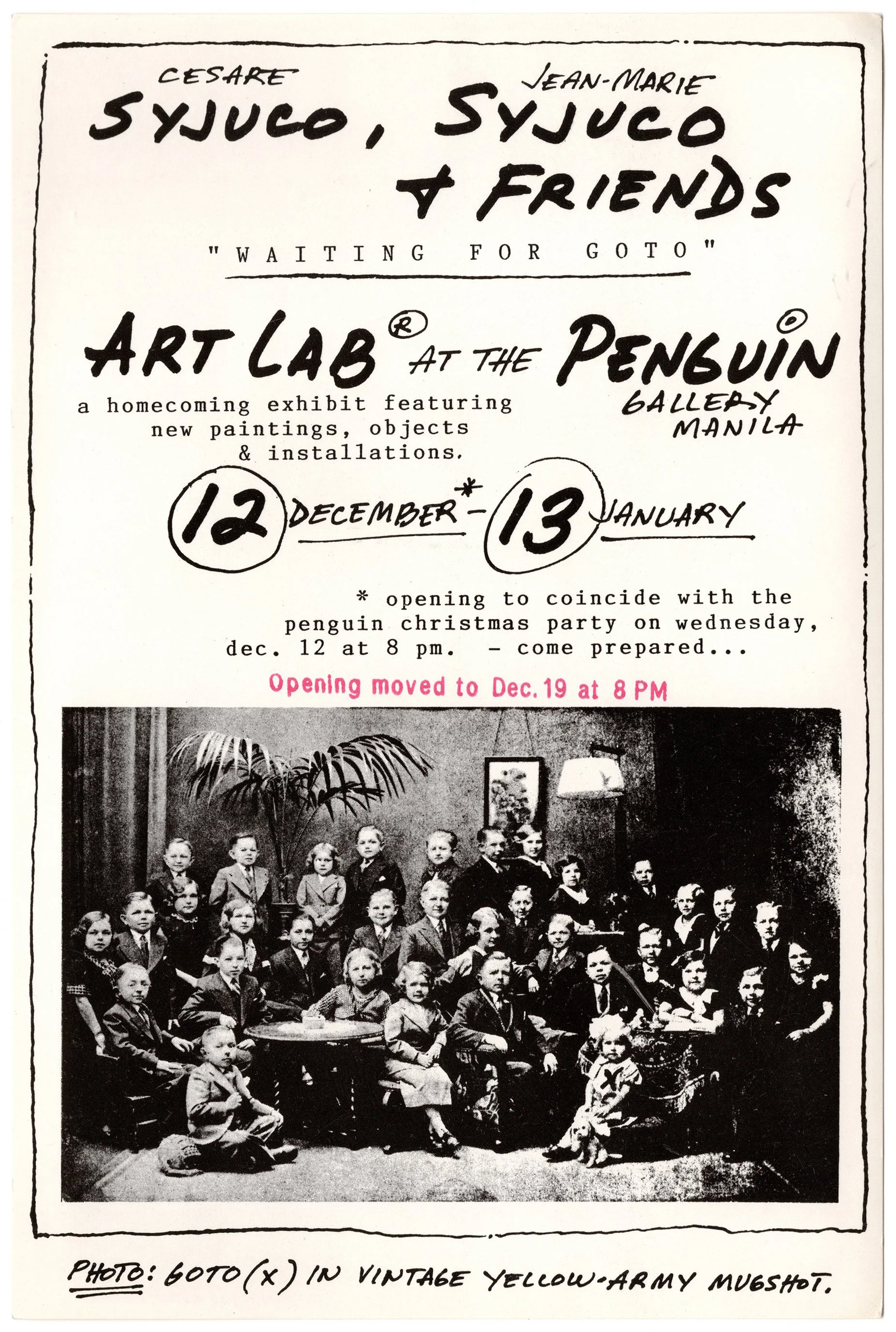 Black and white vintage photograph of a large group of children, likely school students, posed indoors in front of a dark curtain and furniture, with some children sitting on chairs and others standing behind. The bottom caption notes it is a vintage