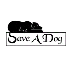 Black dog lying on a sign that says 'Save A Dog'
