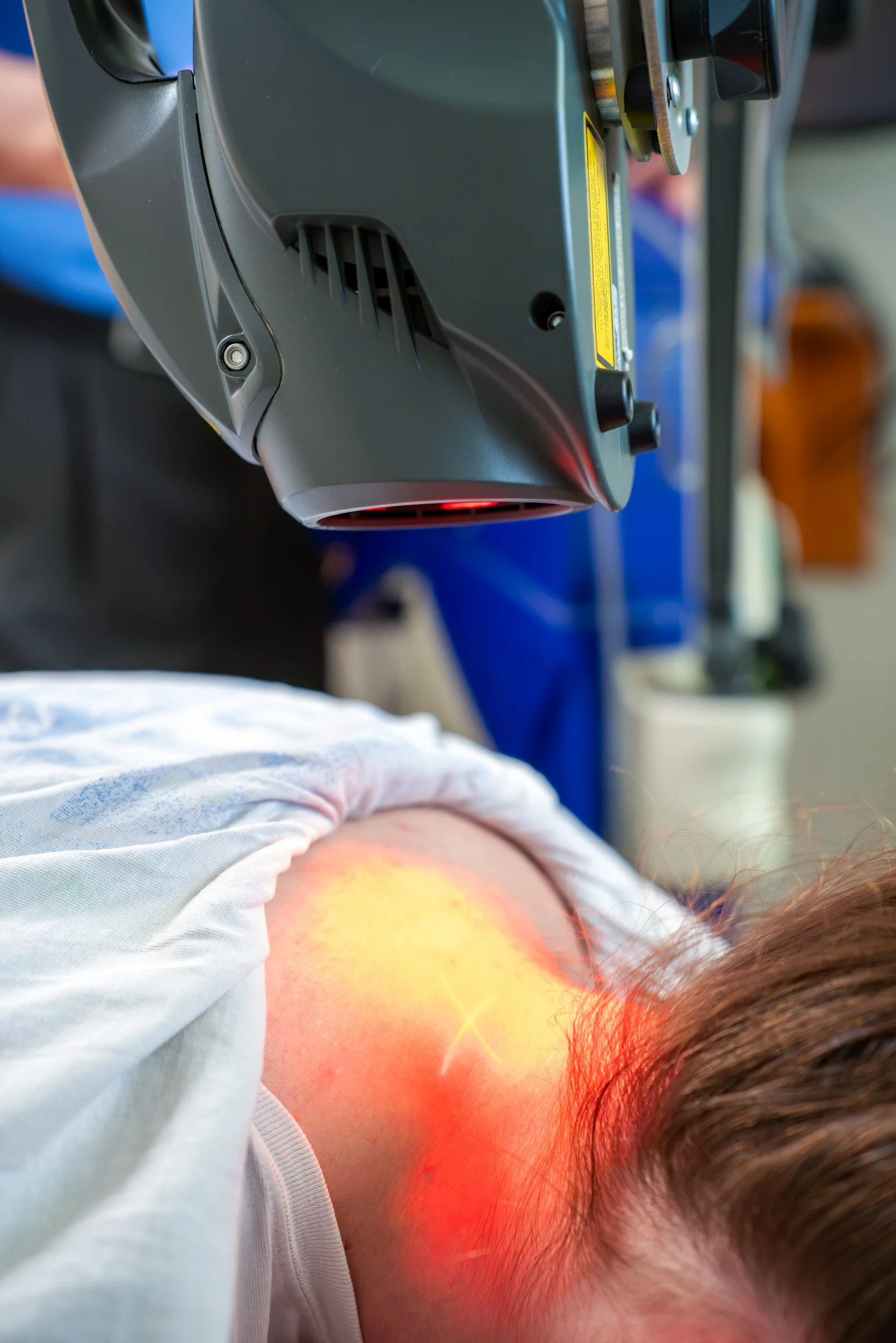 Class IV Laser in use on patients neck to assist in daily comfort.
