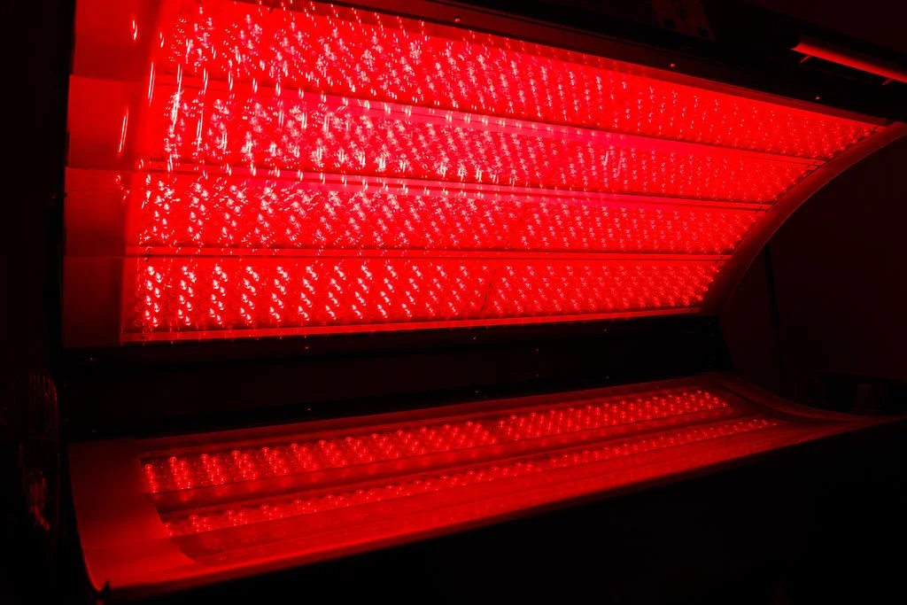 Red LED light panel with multiple small lights arranged in rows and columns.