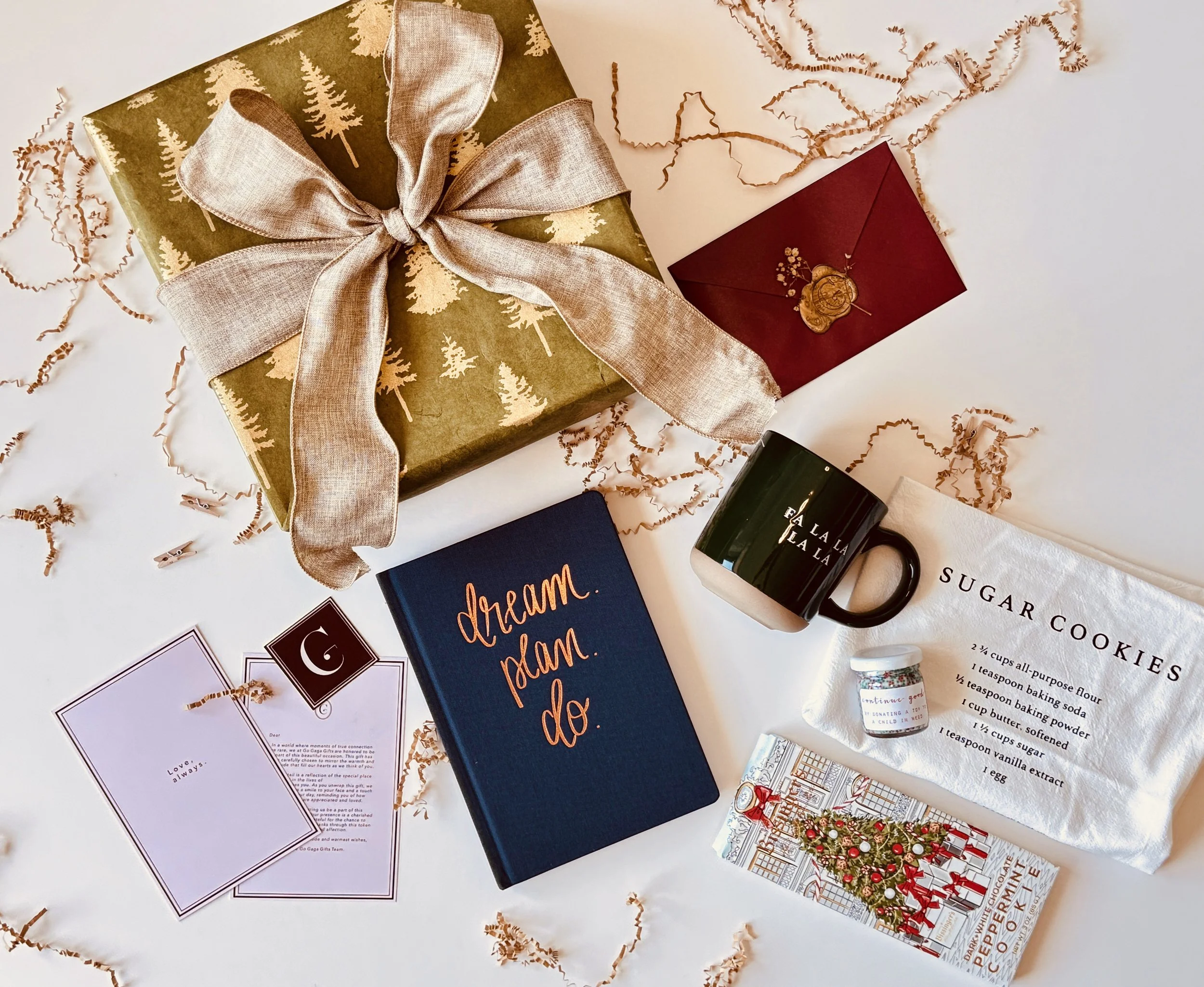 Luxury Christmas gift box with curated holiday products and ribbon-wrapped wooden box