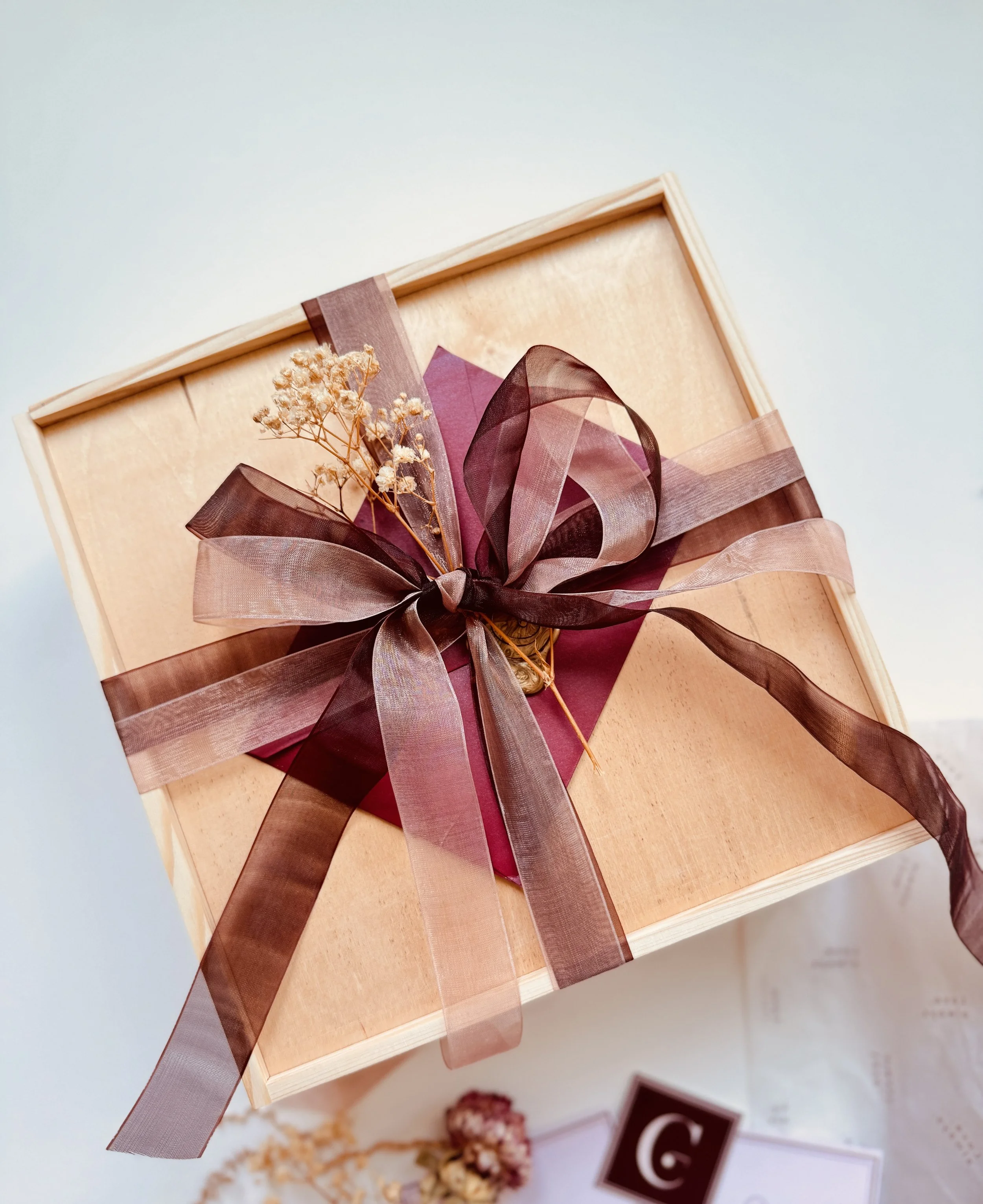 Custom wedding favor gift box with romantic details and ribbon-wrapped presentation