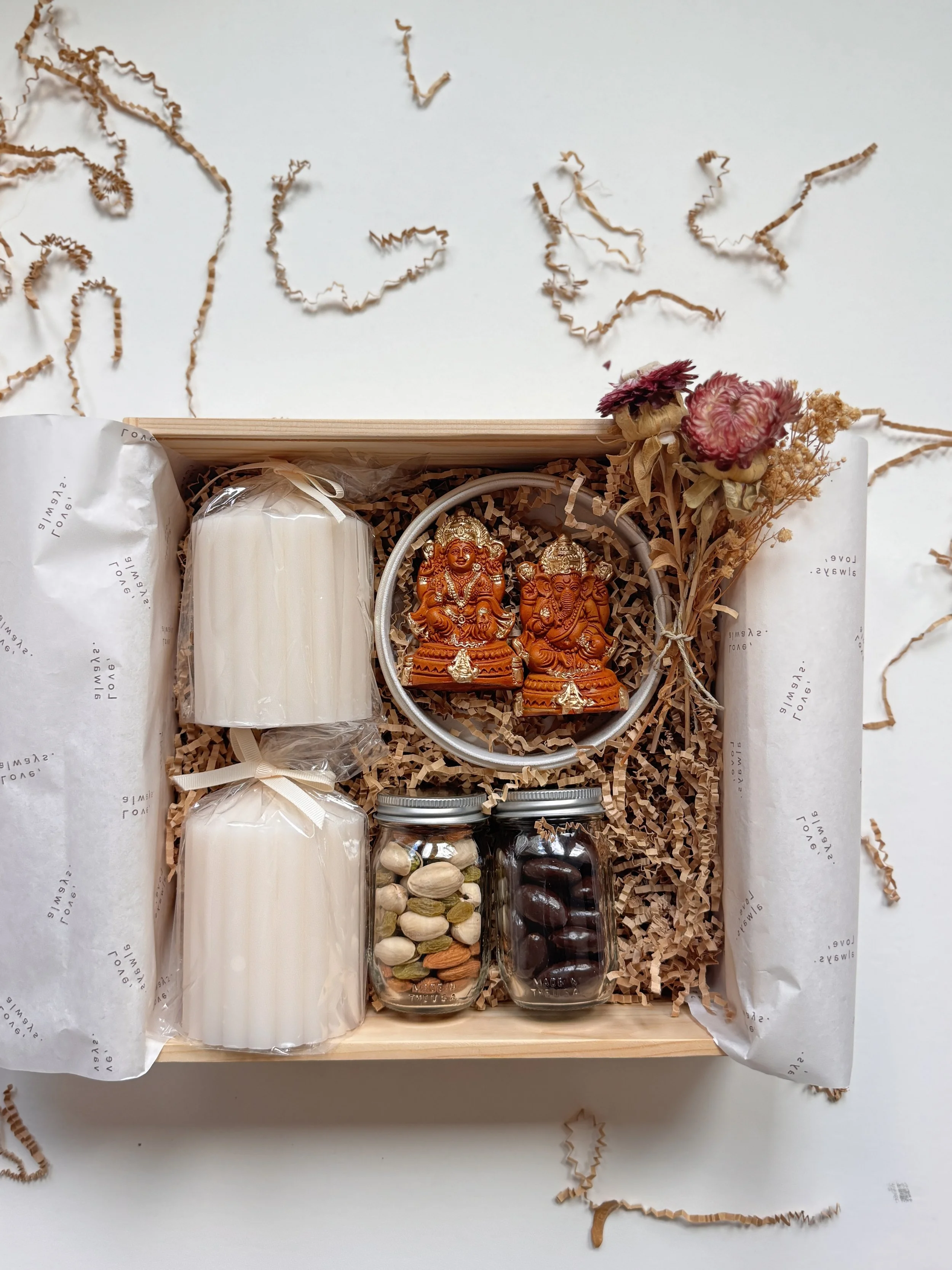 Inside view of Classic Laxmi Ganesh Diwali Box with candles, idols, and gourmet jars