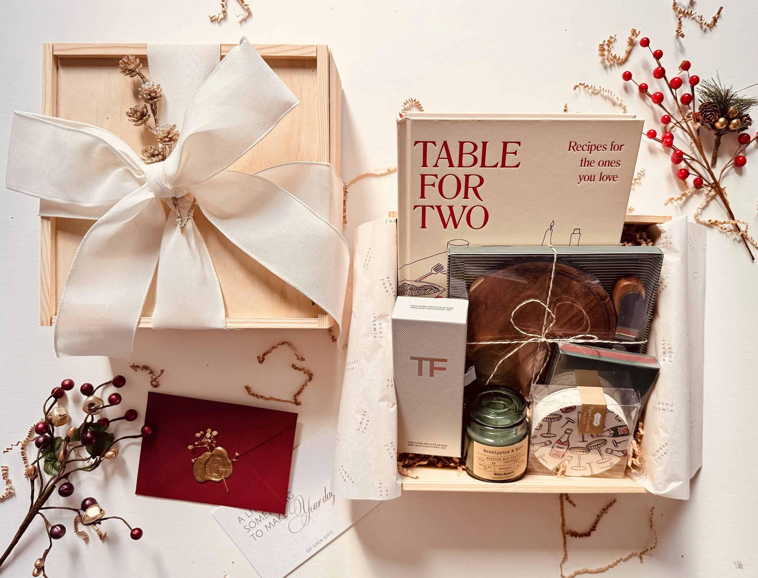 Luxury holiday gift box with cookbook, candle, and Tom Ford duo