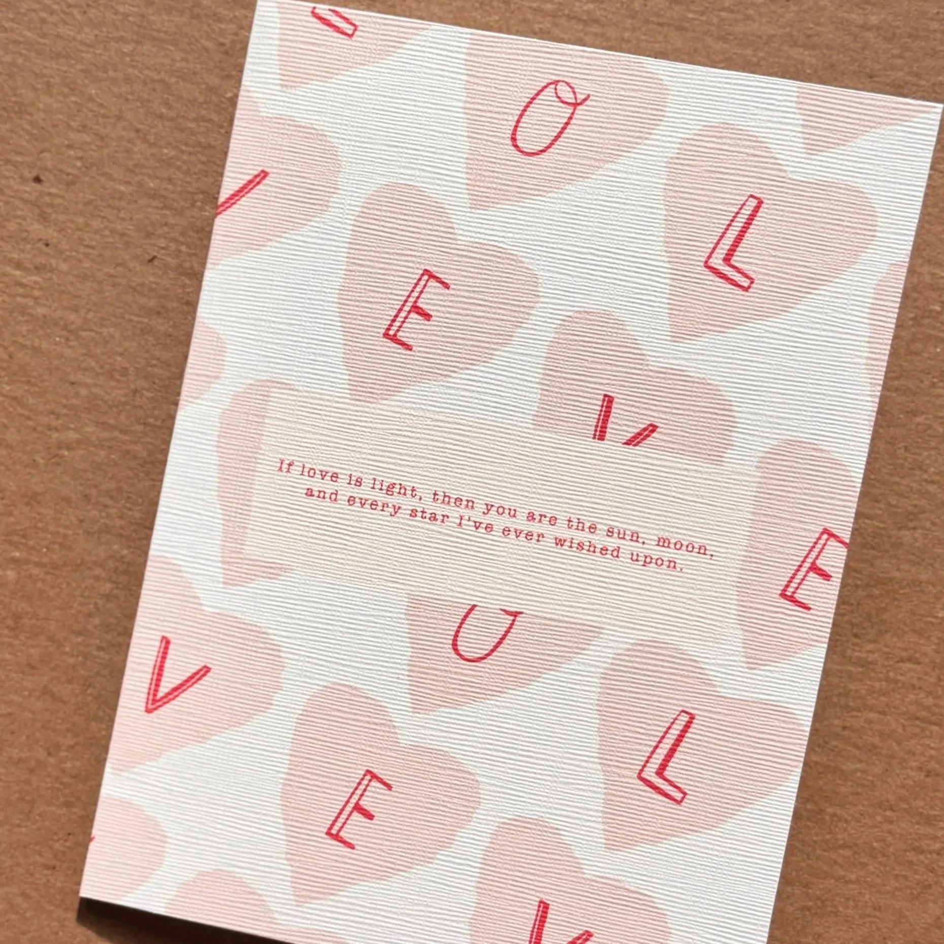 Romantic greeting card detail with poetic love quote and clean Go Gaga design