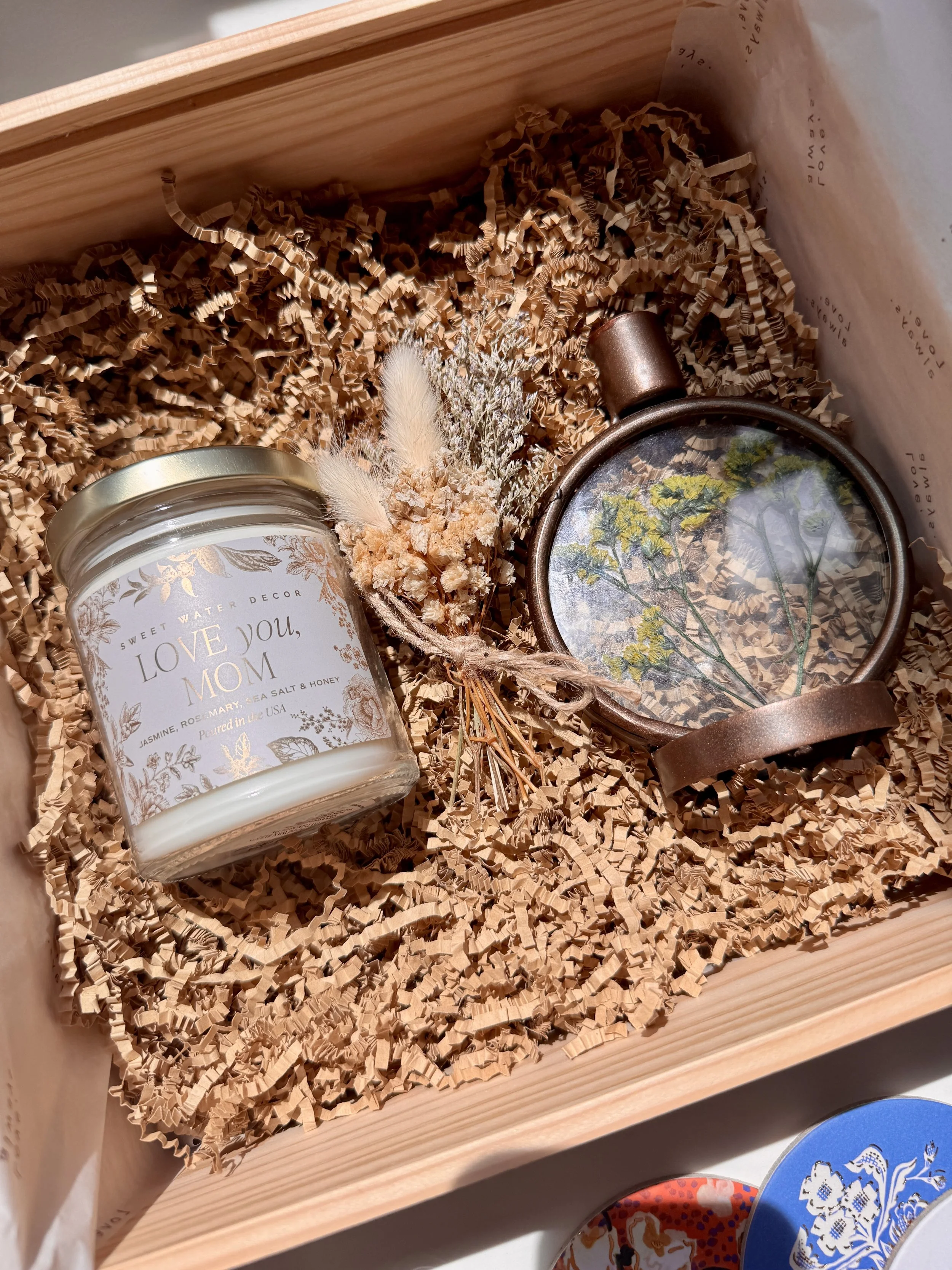 Personalized gift box for mom with candle, decorative flowers, and thoughtful self-care details