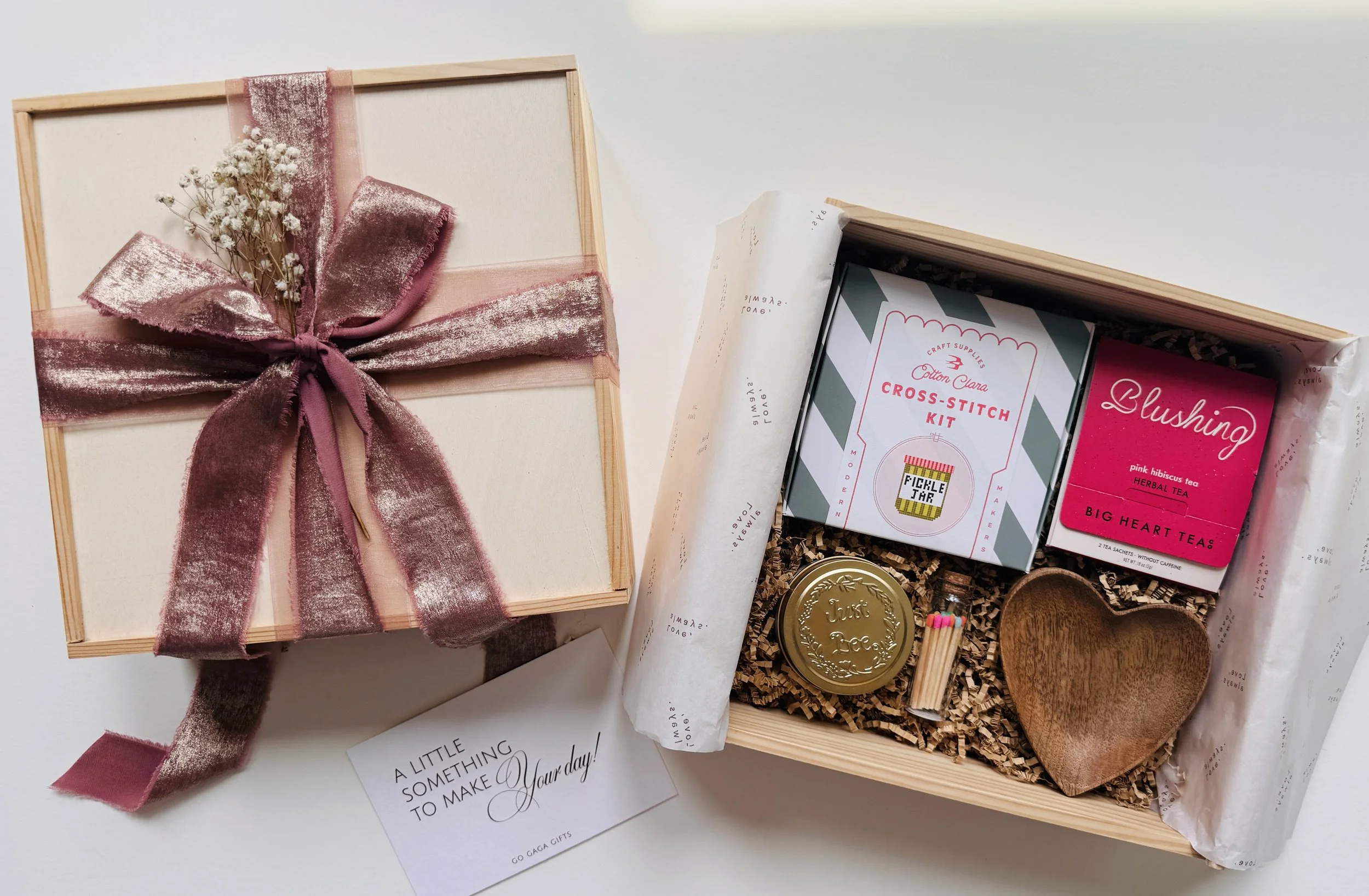 Cozy self-care gift box for her with relaxing lifestyle items and ribbon-wrapped packaging