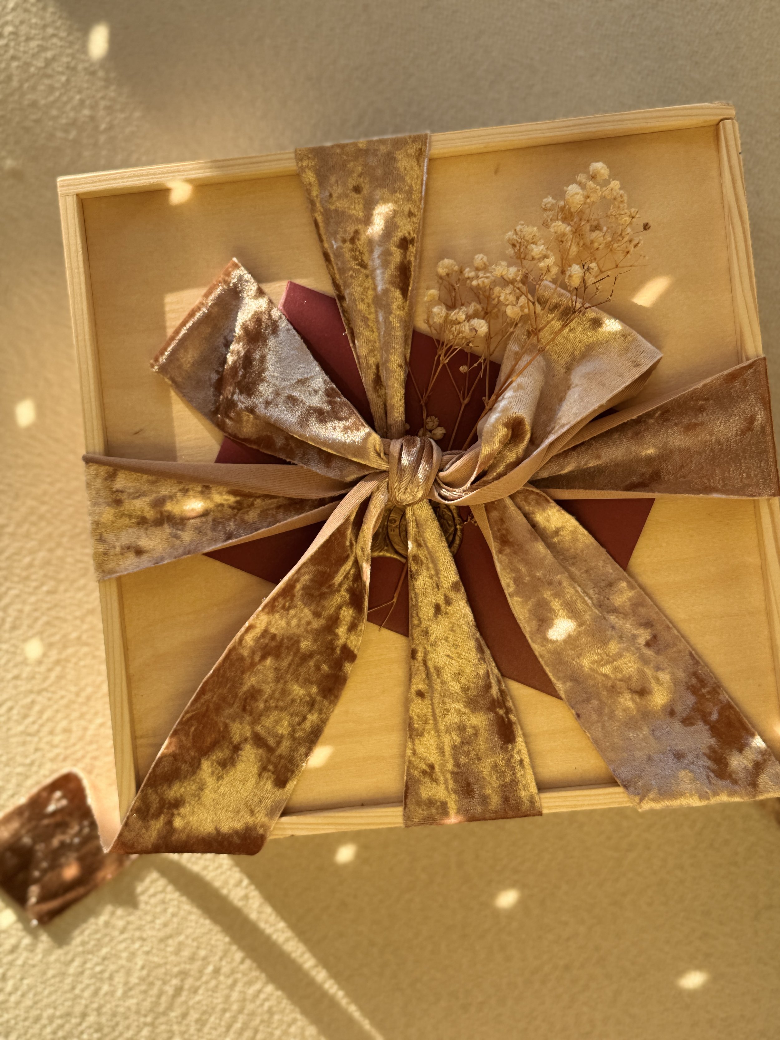 Close-up of a velvet ribbon and dried florals on a Go Gaga Gifts keepsake box