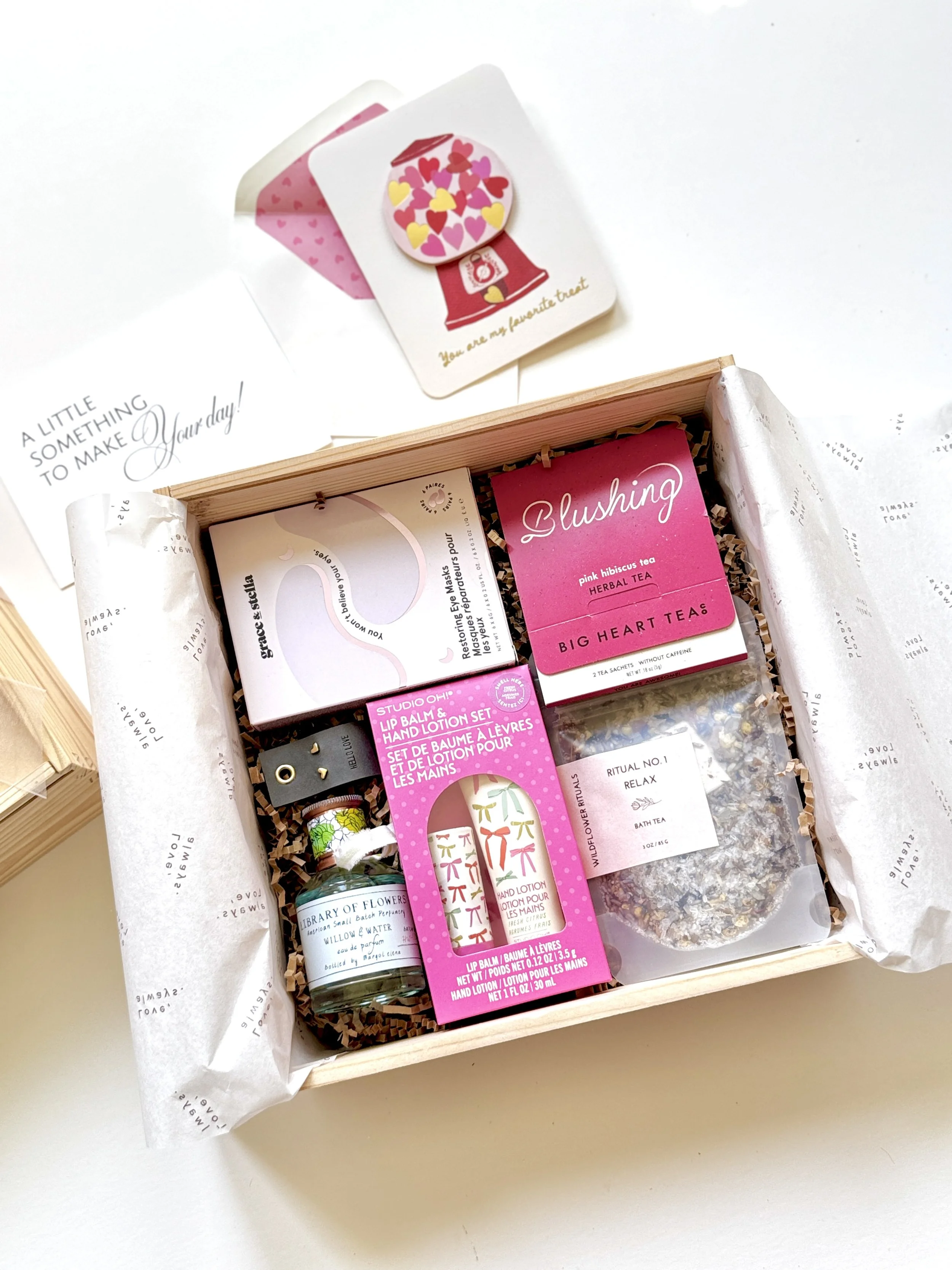 Open Blush & Bloom Box with tea, self-care gifts, perfume and heart stud earrings