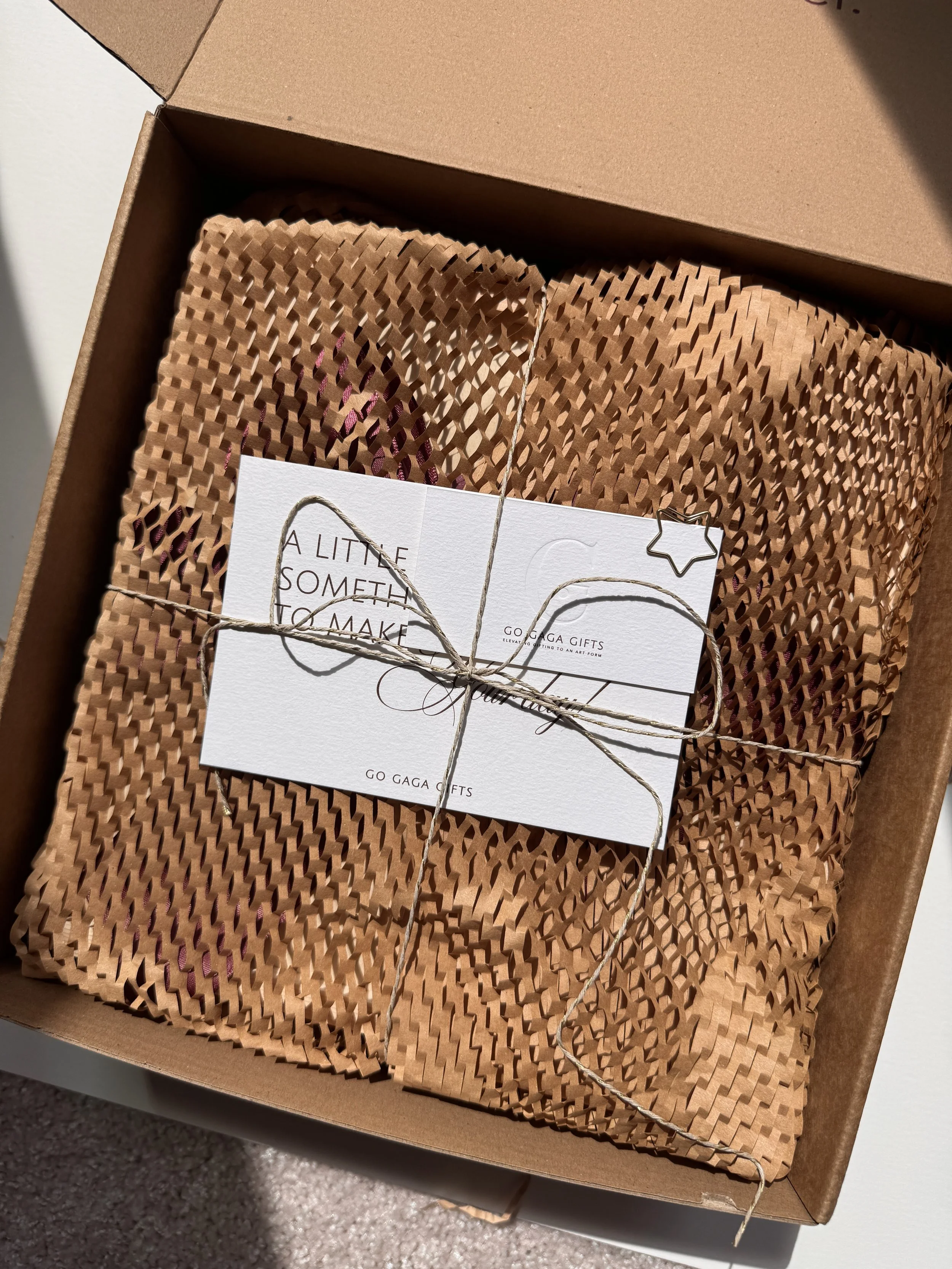 A Go Gaga Gifts box beautifully packaged and finished with a hand-tied ribbon