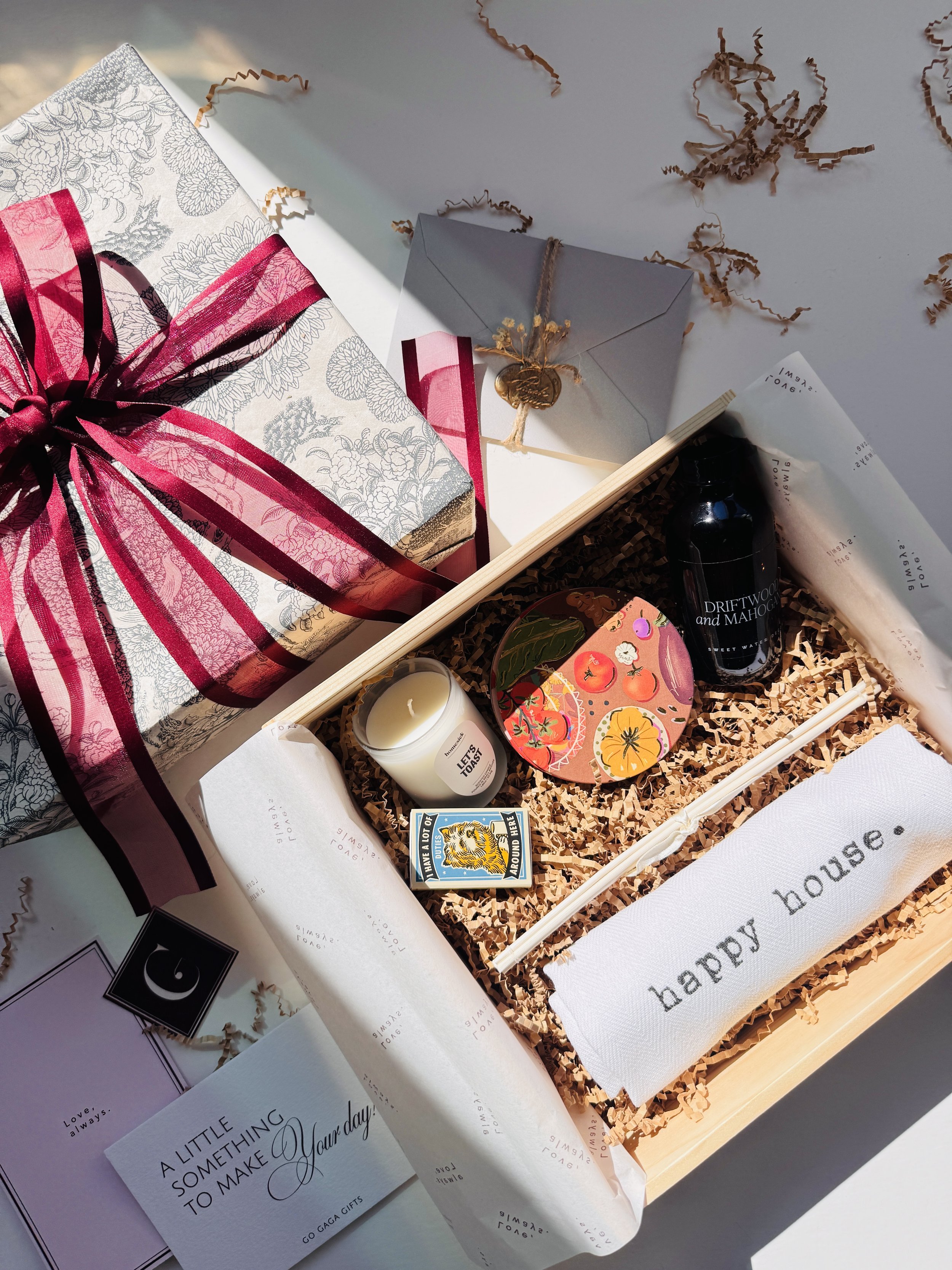 The Happy House Box with candle, diffuser, coaster and embroidered kitchen towel