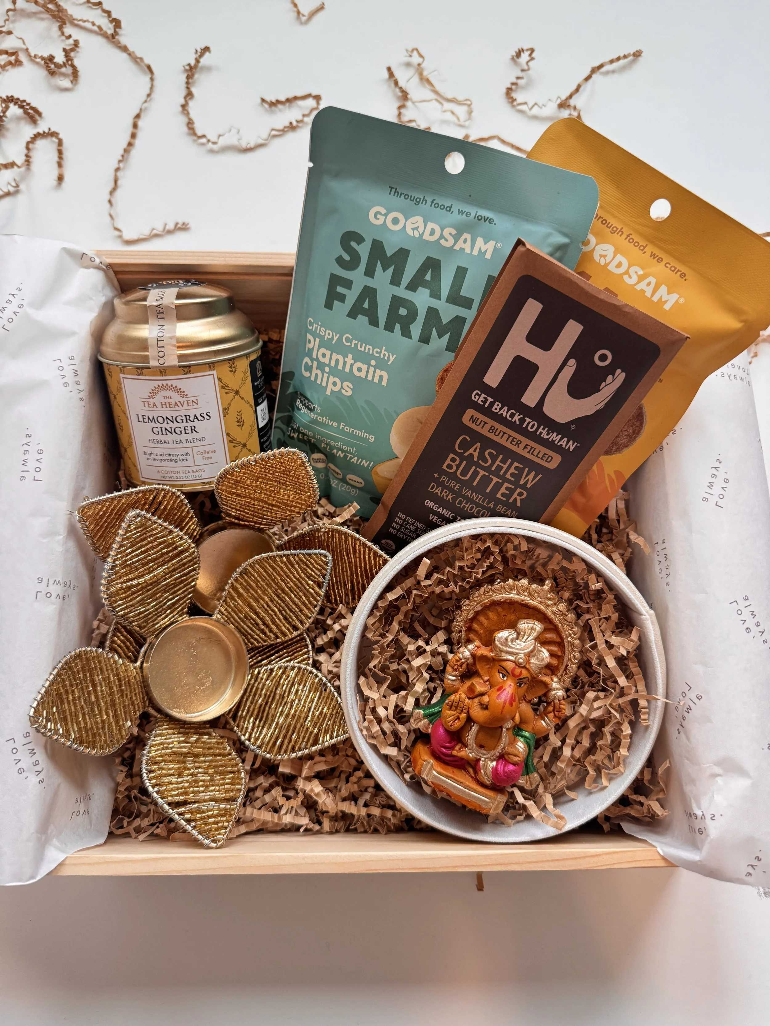 The Gourmet Diwali Box with a handcrafted Ganesh idol, gourmet tea, chocolate and tealight holders