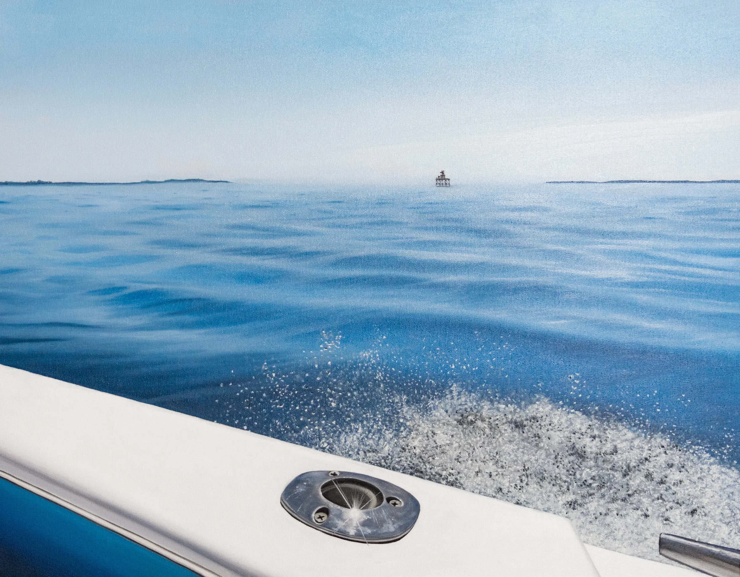 View from a boat showing blue ocean water, a small boat in the distance, and a shoreline on the horizon.