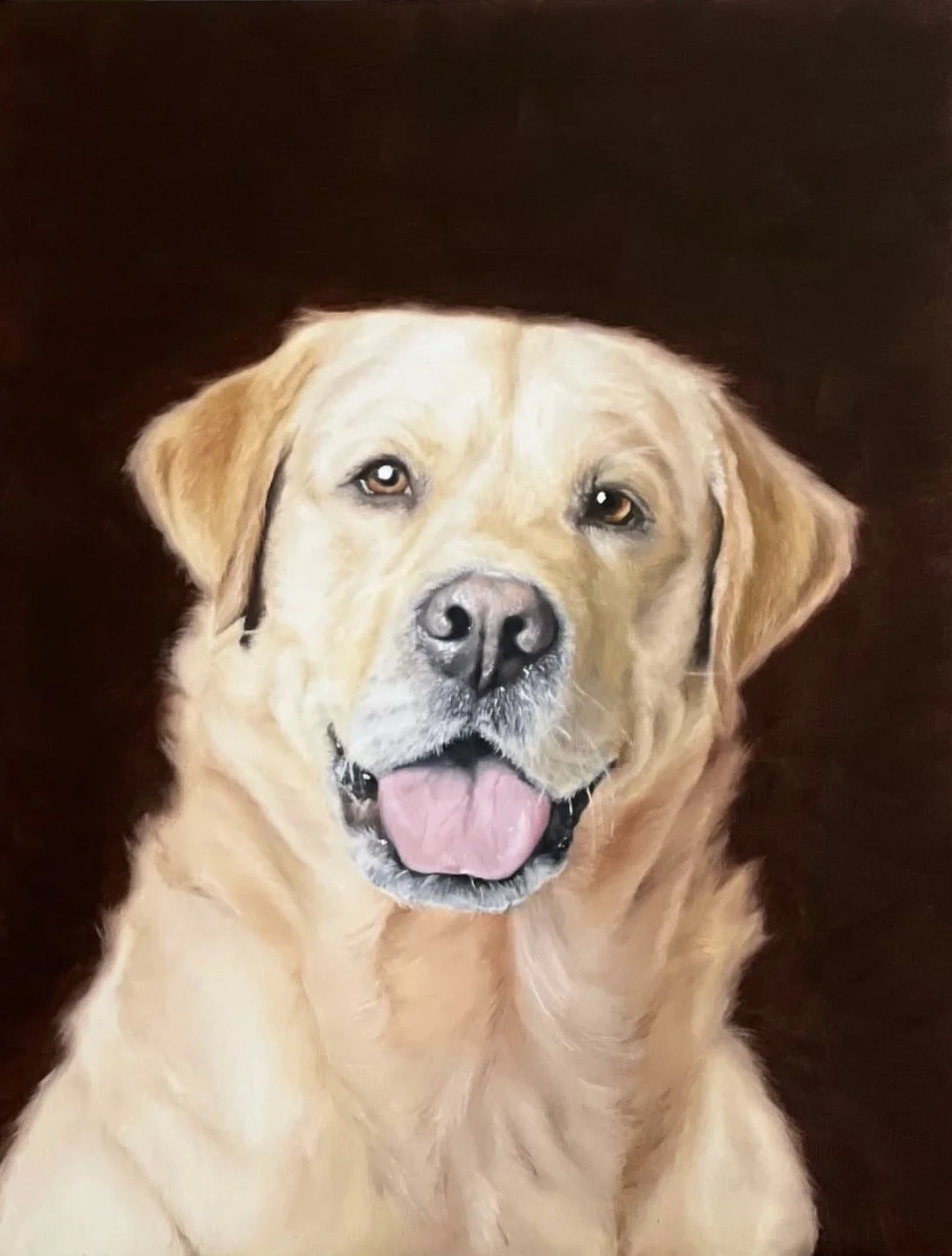 A portrait of a yellow Labrador retriever dog with a pink tongue and expressive eyes, sitting against a dark background.