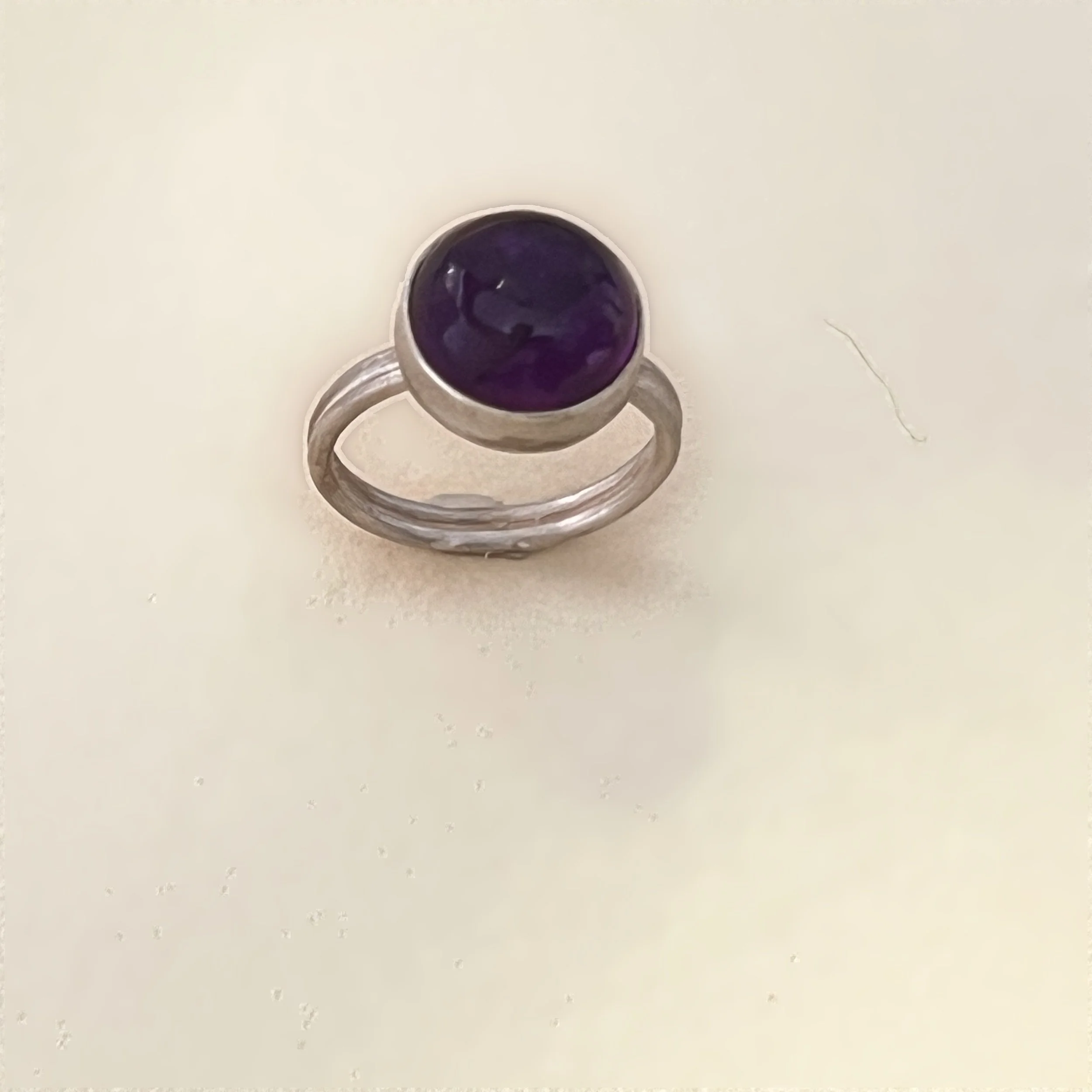 Ring — round amethyst cabochon set in sterling silver.
Band 2mm · thickness 1mm · stone 12mm
