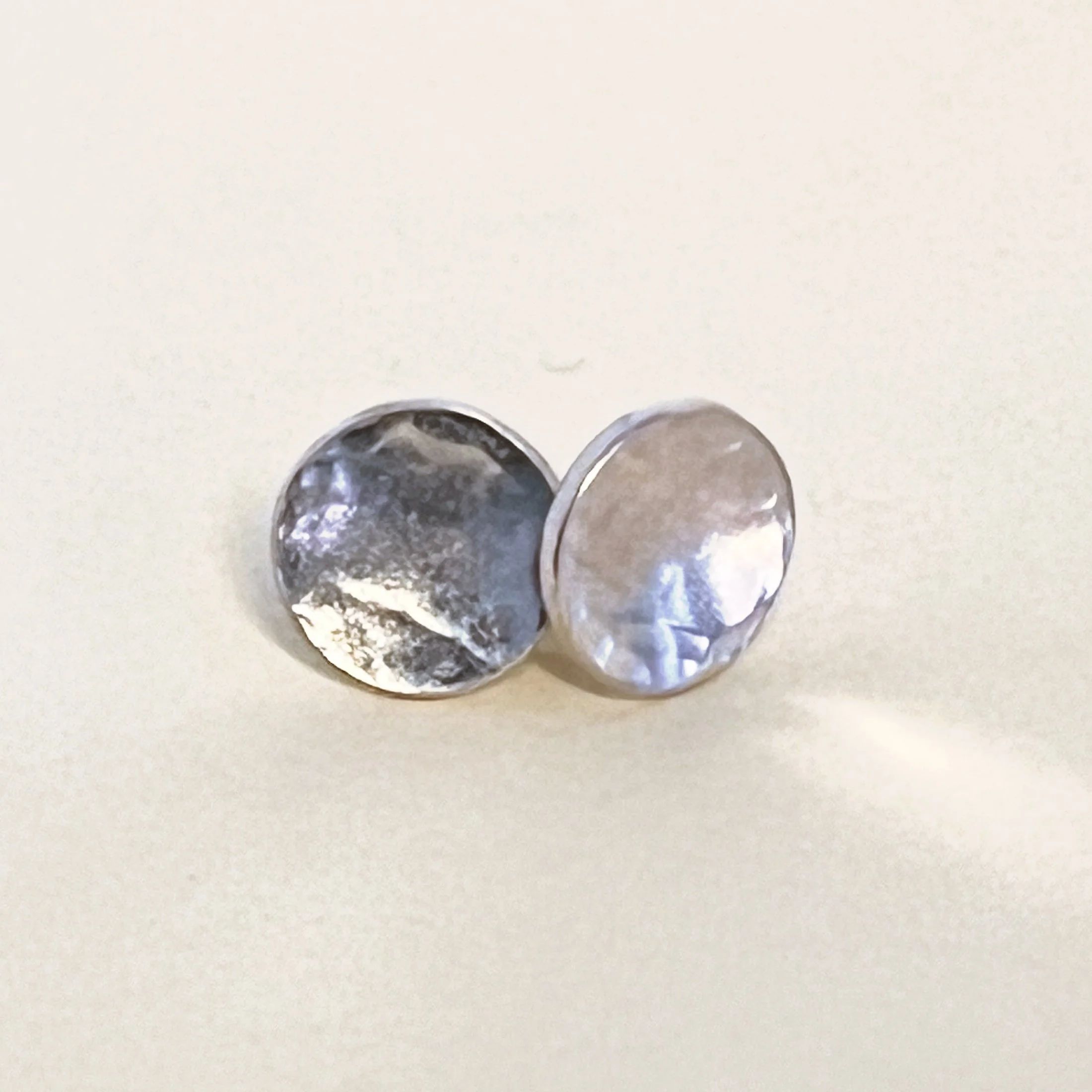 Stud earrings — hammered sterling silver discs.
10mm.