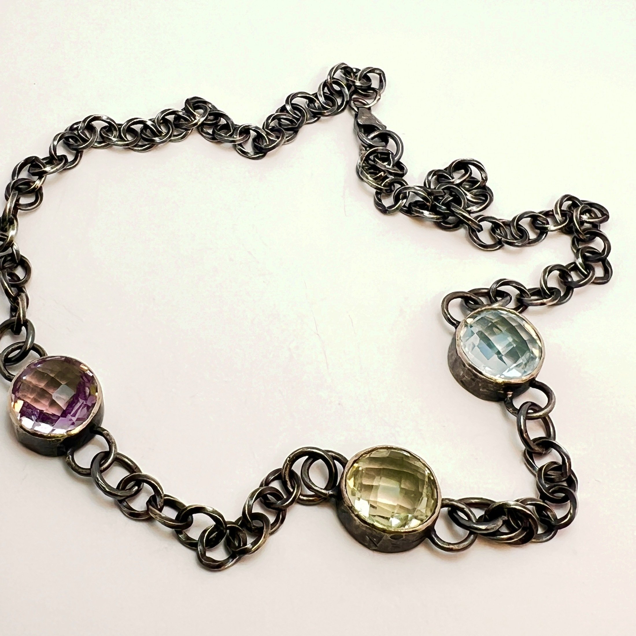 Three-stone necklace  — checkerboard-cut amethyst, citrine and blue topaz on oxidized sterling silver rolo chain. 
Chain 17.5 in · stones 12mm
