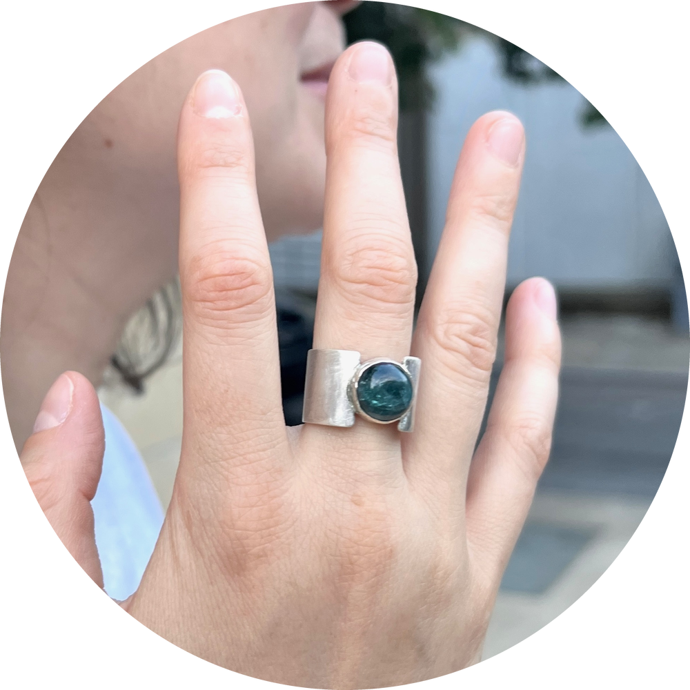 Hannah, wearing the double band ring with green tourmaline