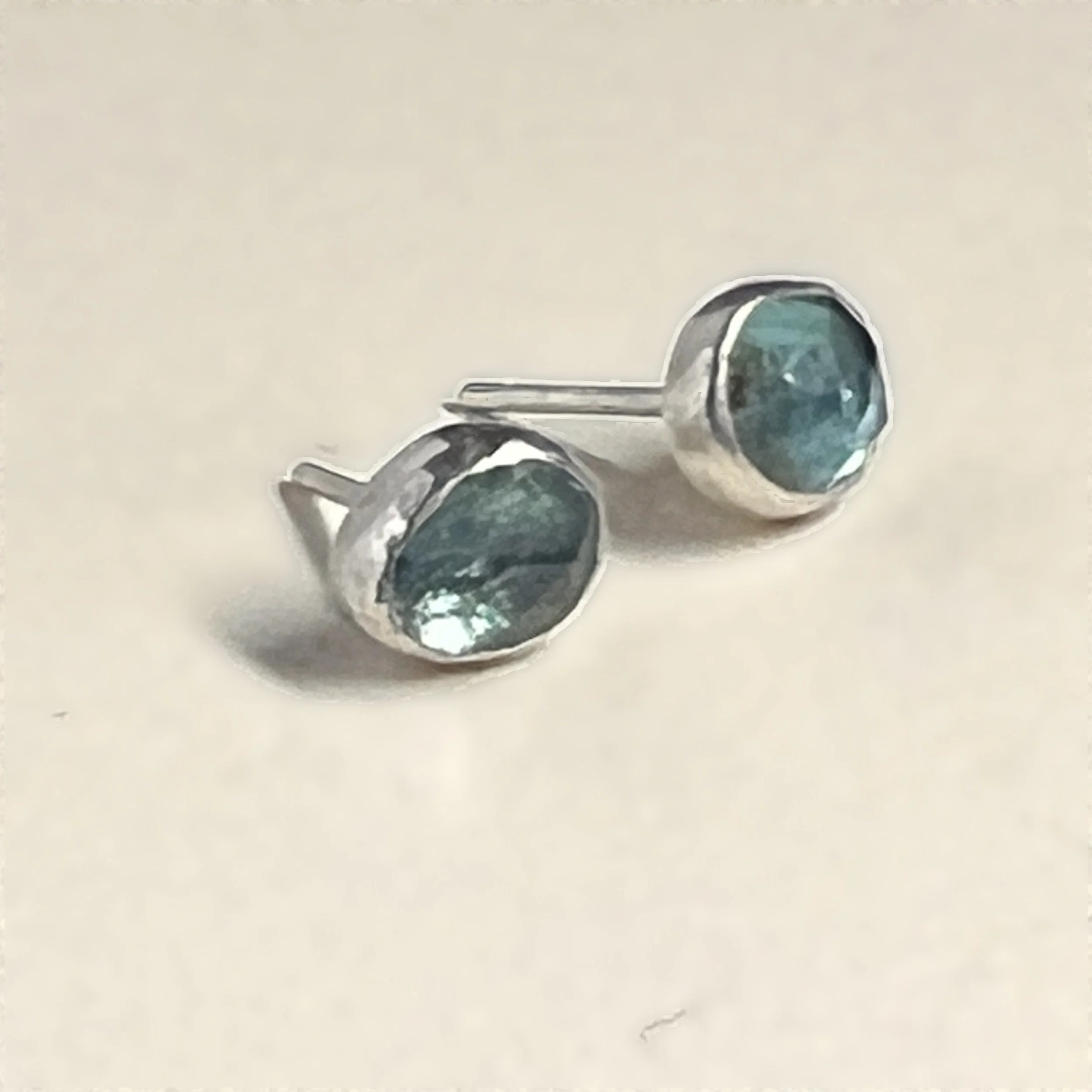 stud earrings — rose-cut paraiba apatite set in sterling silver.
Stones 6x8mm