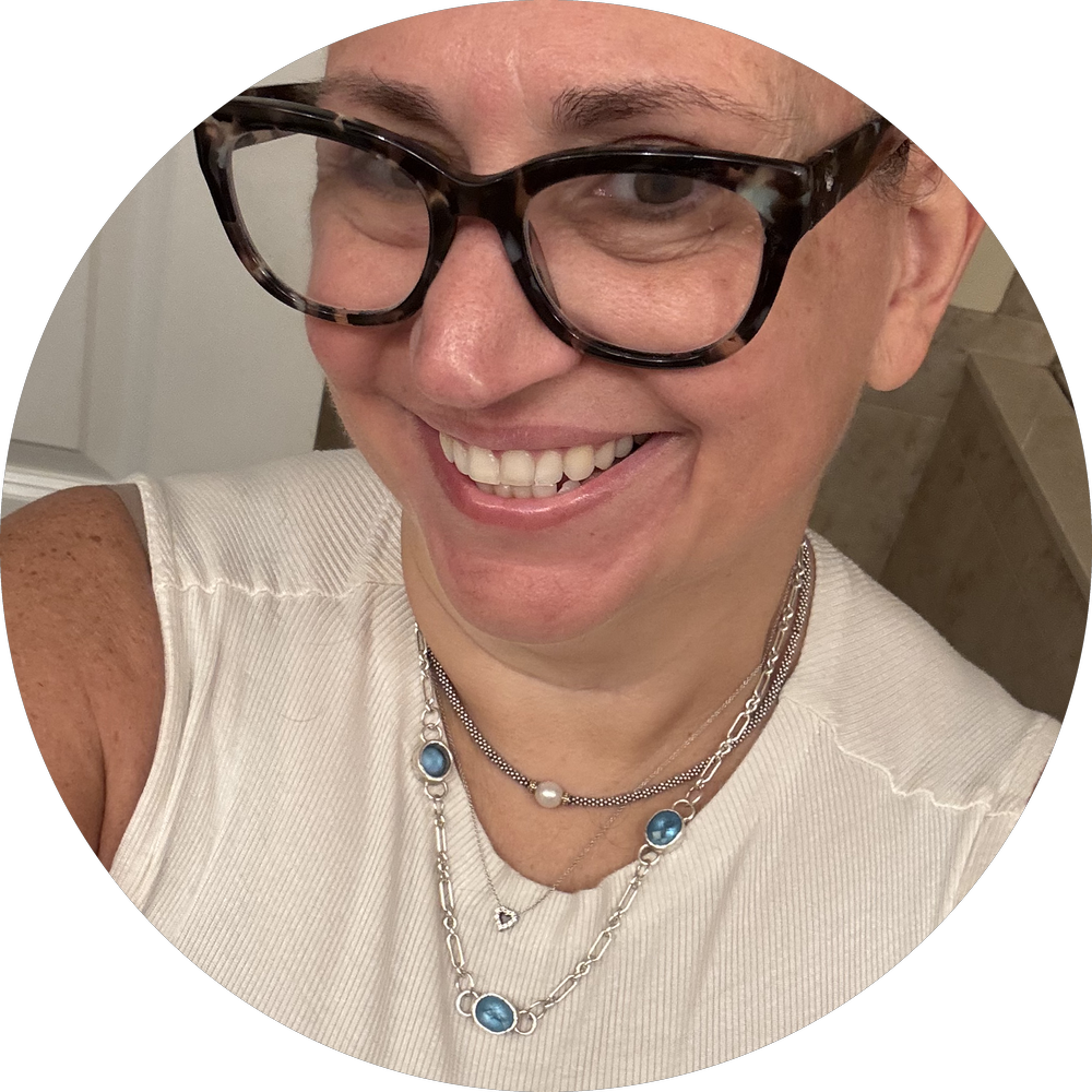 Maddie, wearing the three-stone blue topaz necklace. "It elevates an everyday outfit — it makes me feel pretty."