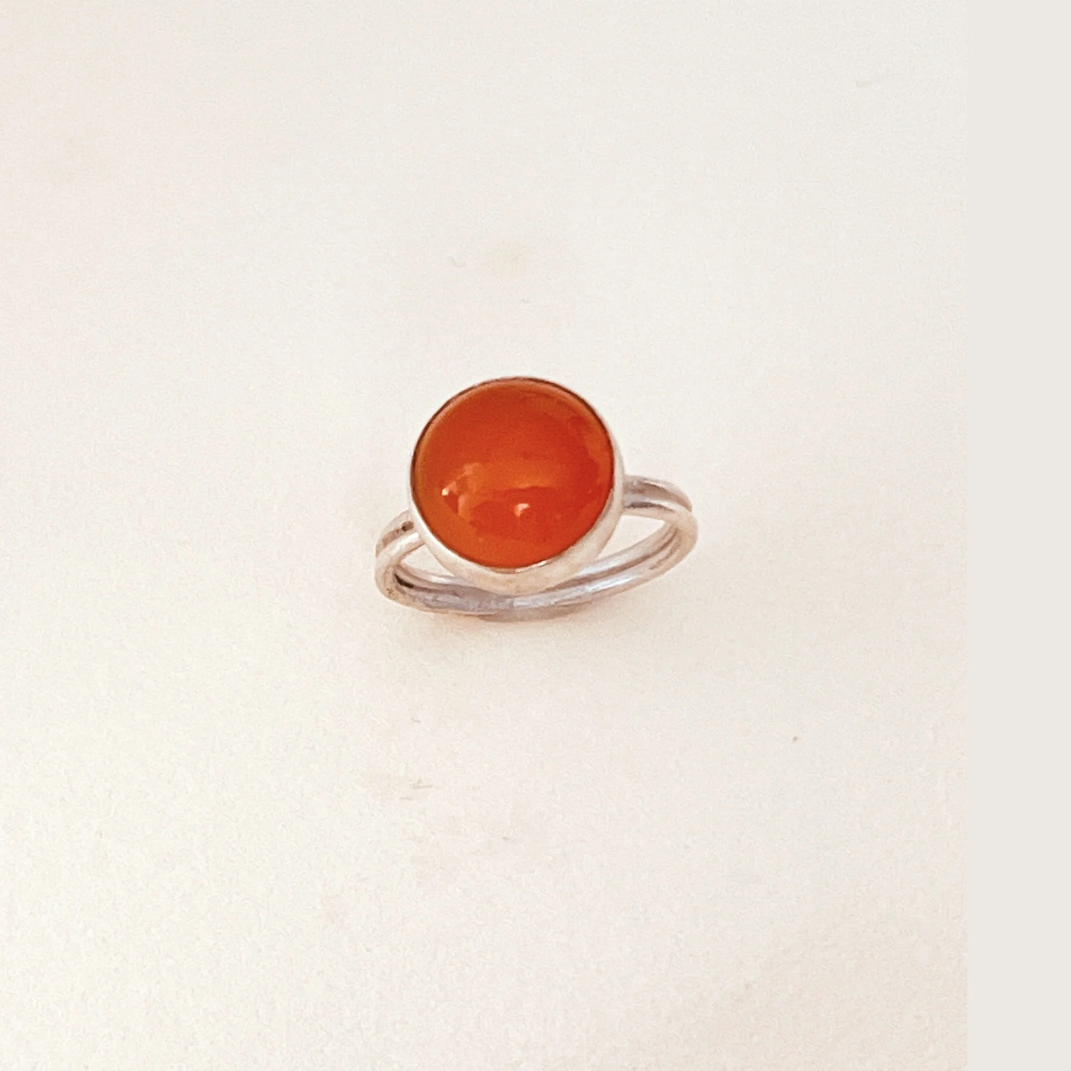 Ring — orange chalcedony cabochon set in sterling silver.
Band 2mm · thickness 1mm  · stone size 12mm