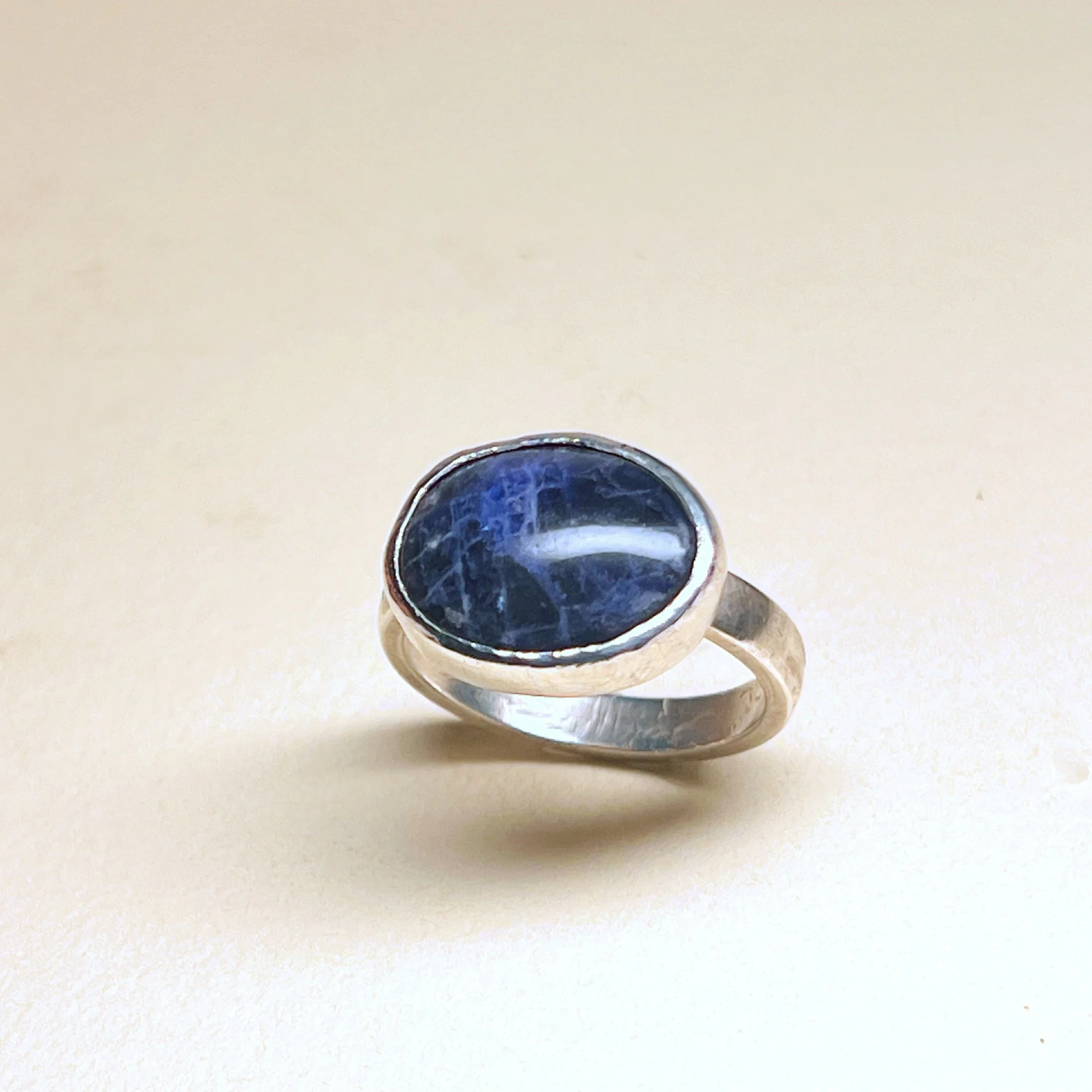Ring — deep blue sodalite cabochon set in sterling silver.
Band 3.5mm · thickness 2mm · stone 20mm