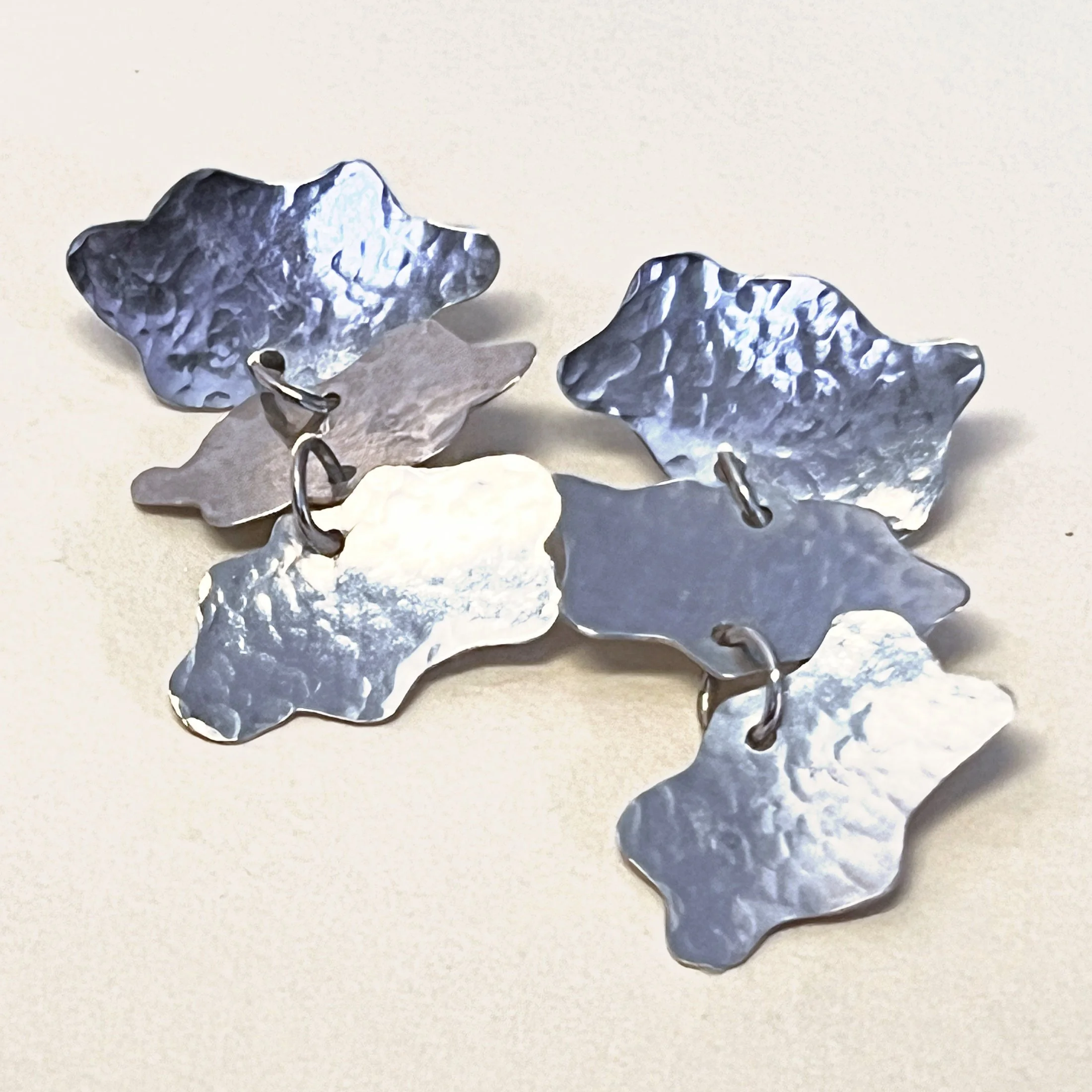 Cloud dangler earrings — three hand-cut sterling silver clouds.
Drop 40mm