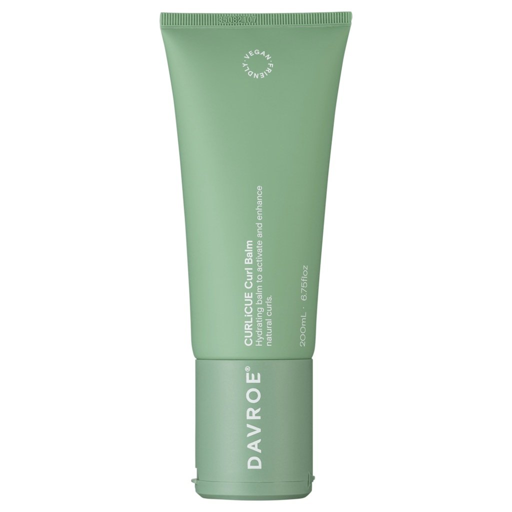 August in Tauranga brings cool air + coastal moisture, which makes hair swell, frizz, or lose shape &mdash; especially curls.

Apply a pea‑sized amount of Curl balm to damp hair. Focus on the mid‑lengths and ends, where frizz shows first.

Scrunch in